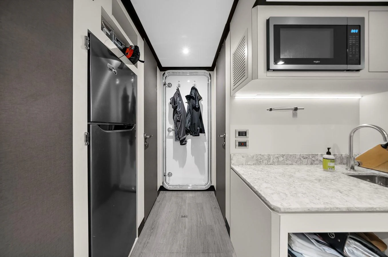 A compact galley featuring modern appliances and a sleek design. aboard LA LA LA Yacht for Sale