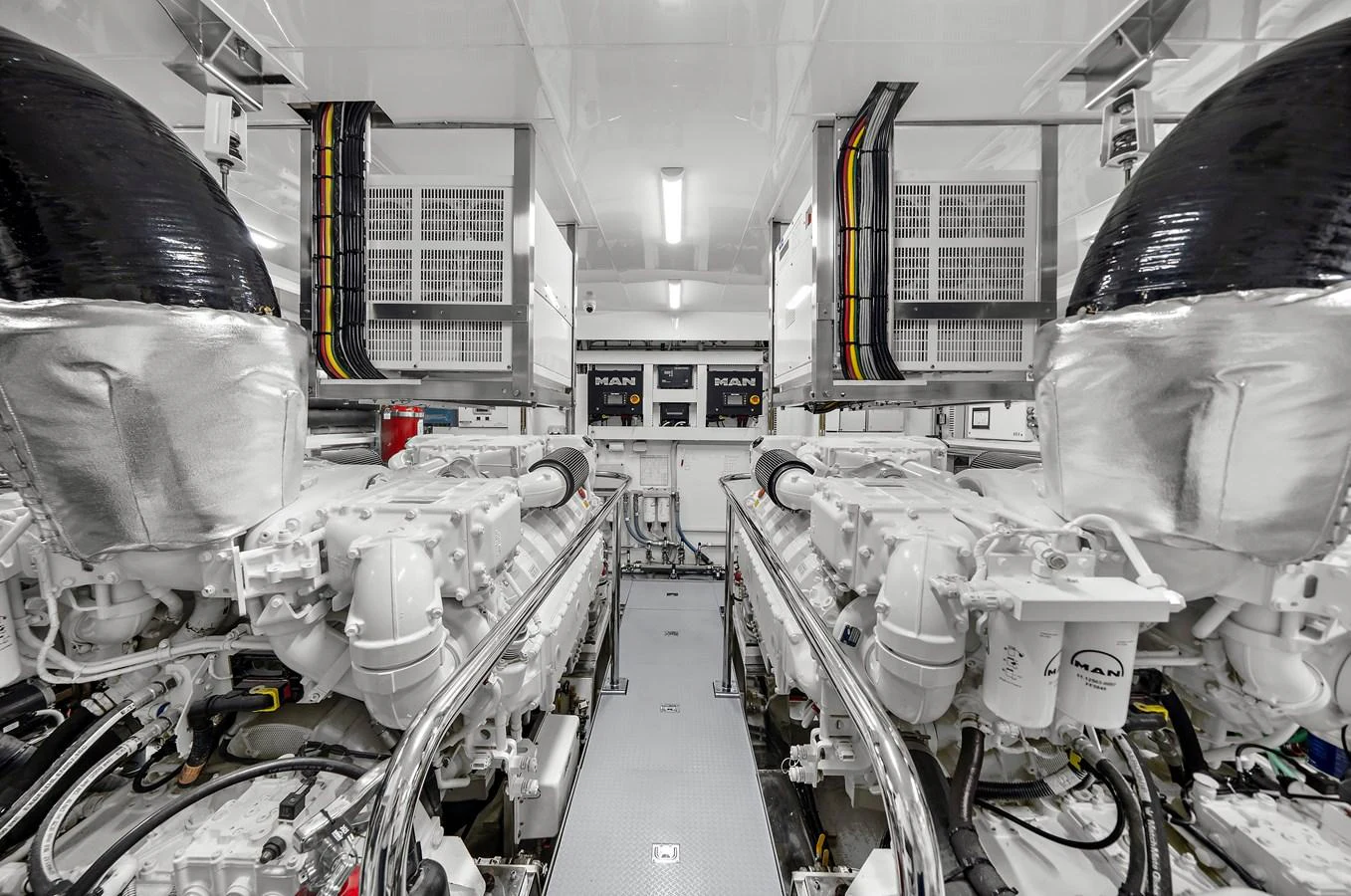 The image showcases the pristine and well-organized engine room of the yacht, highlighting its advanced machinery. aboard LA LA LA Yacht for Sale