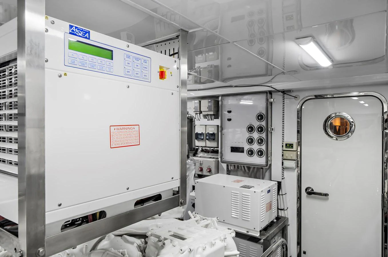 The image showcases the yacht's well-equipped engine room with advanced control systems. aboard LA LA LA Yacht for Sale