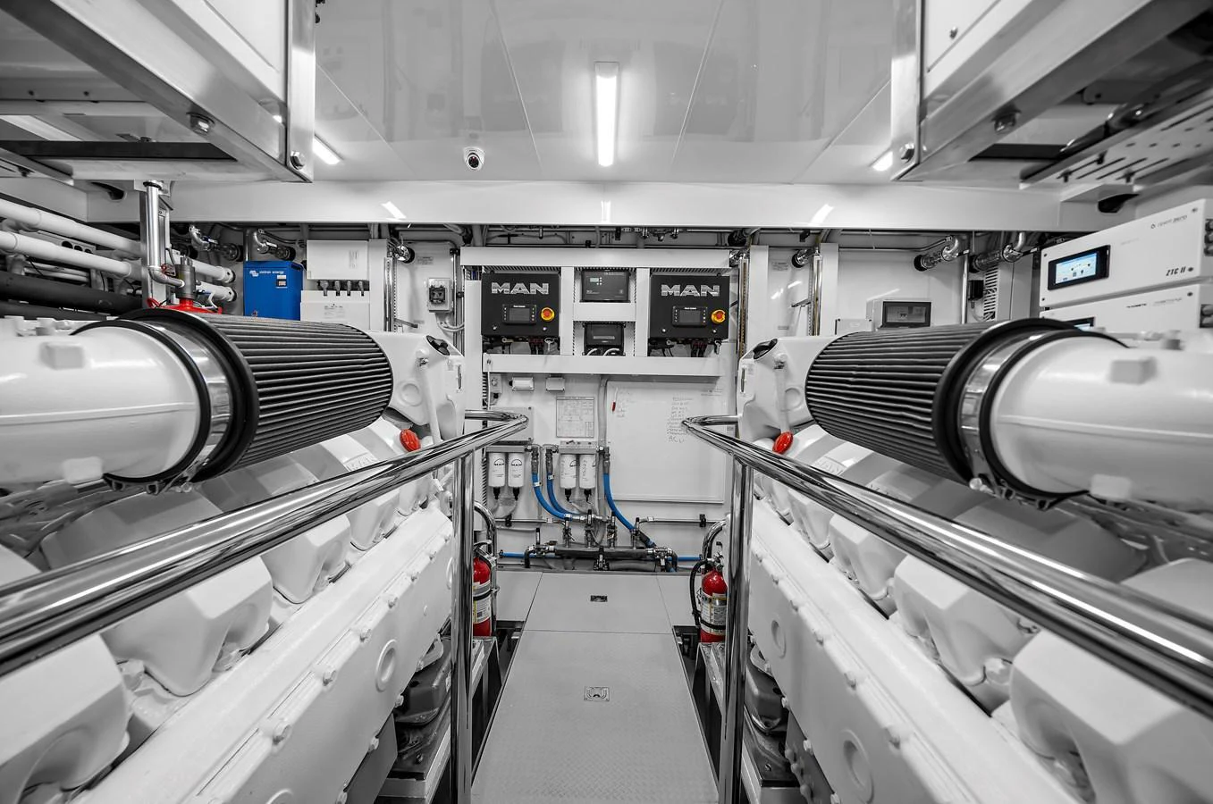 The engine room showcases powerful machinery and a clean, organized layout. aboard LA LA LA Yacht for Sale
