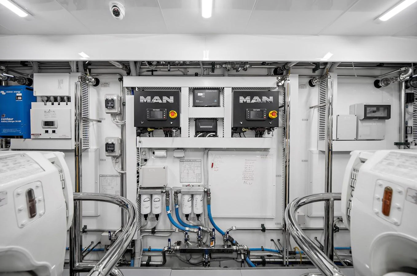 The engine room features advanced machinery and a clean, organized layout. aboard LA LA LA Yacht for Sale