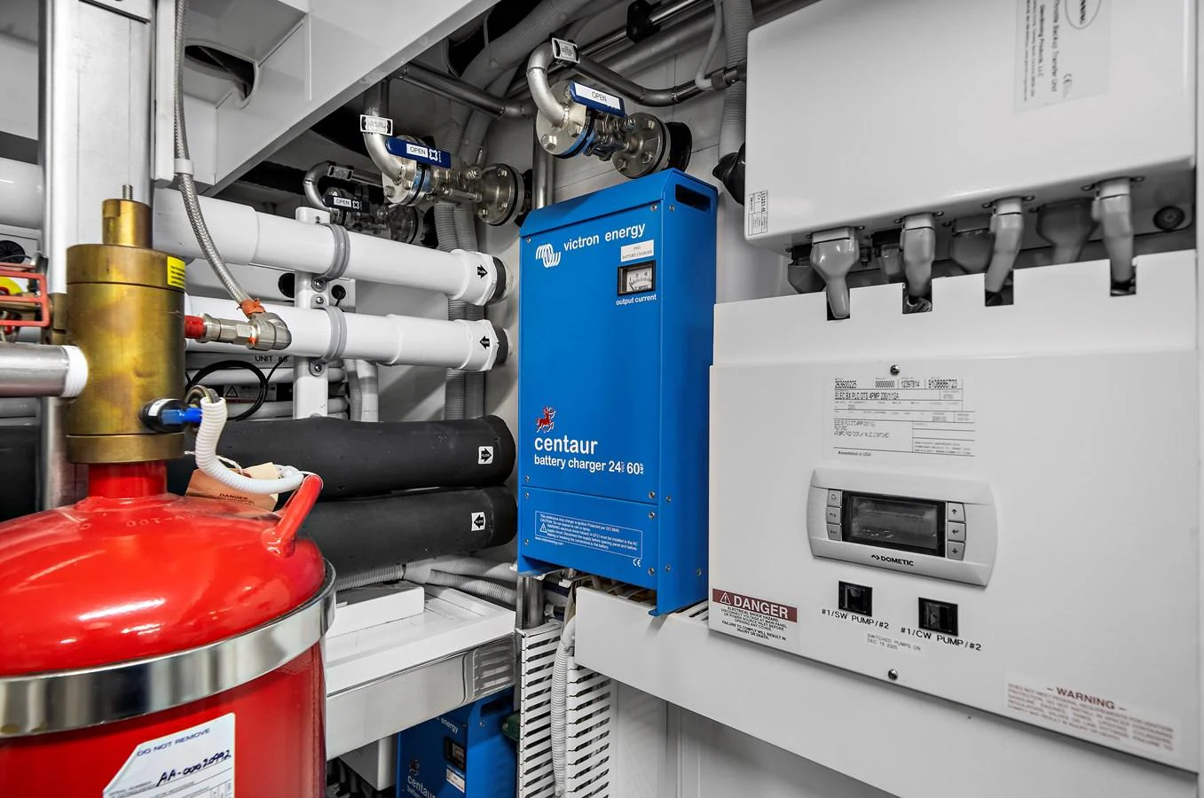 The image showcases the technical equipment and systems within the yacht's engine room. aboard LA LA LA Yacht for Sale