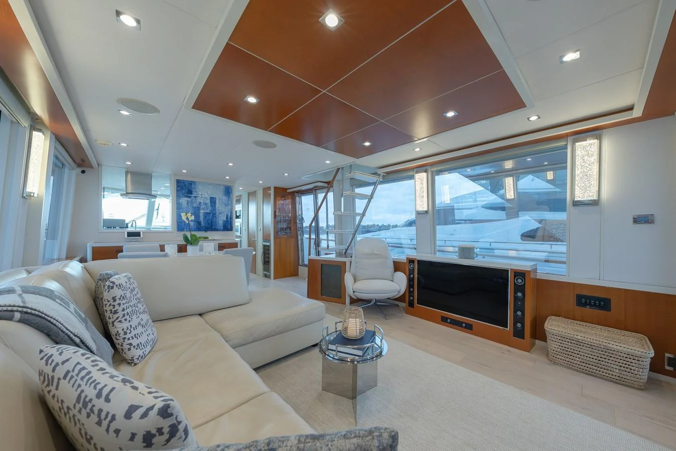 The salon offers a spacious and elegant living area with modern furnishings and large windows for panoramic views. aboard WHISTLE Yacht for Sale