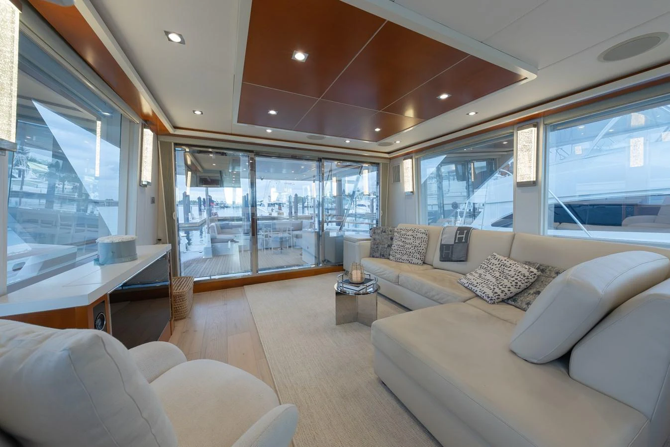 The salon features a spacious and elegant seating area with large windows offering panoramic views. aboard WHISTLE Yacht for Sale