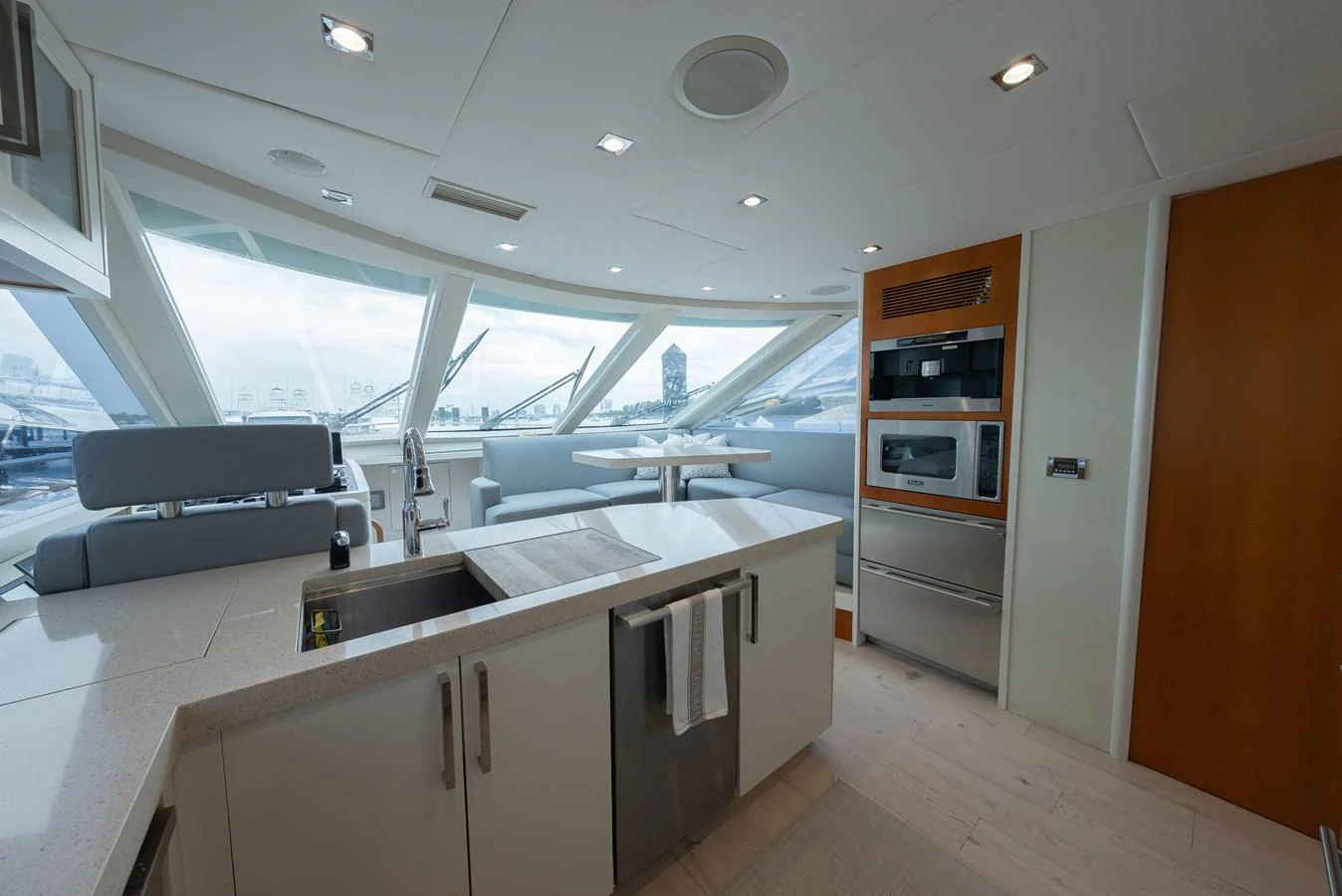The yacht's galley is modern and well-equipped, featuring sleek appliances and ample natural light. aboard WHISTLE Yacht for Sale