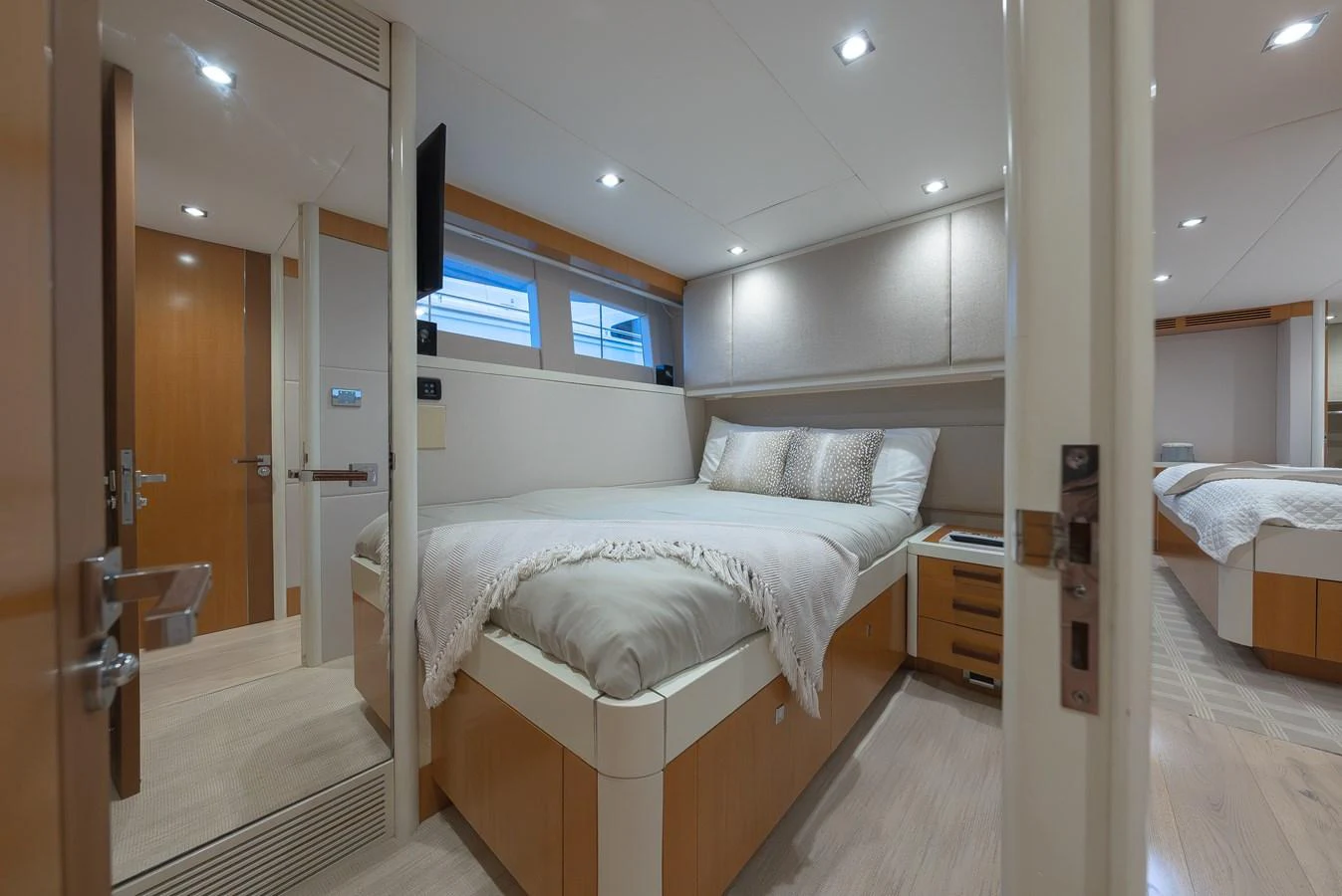 A cozy stateroom with a comfortable bed and modern decor. aboard WHISTLE Yacht for Sale