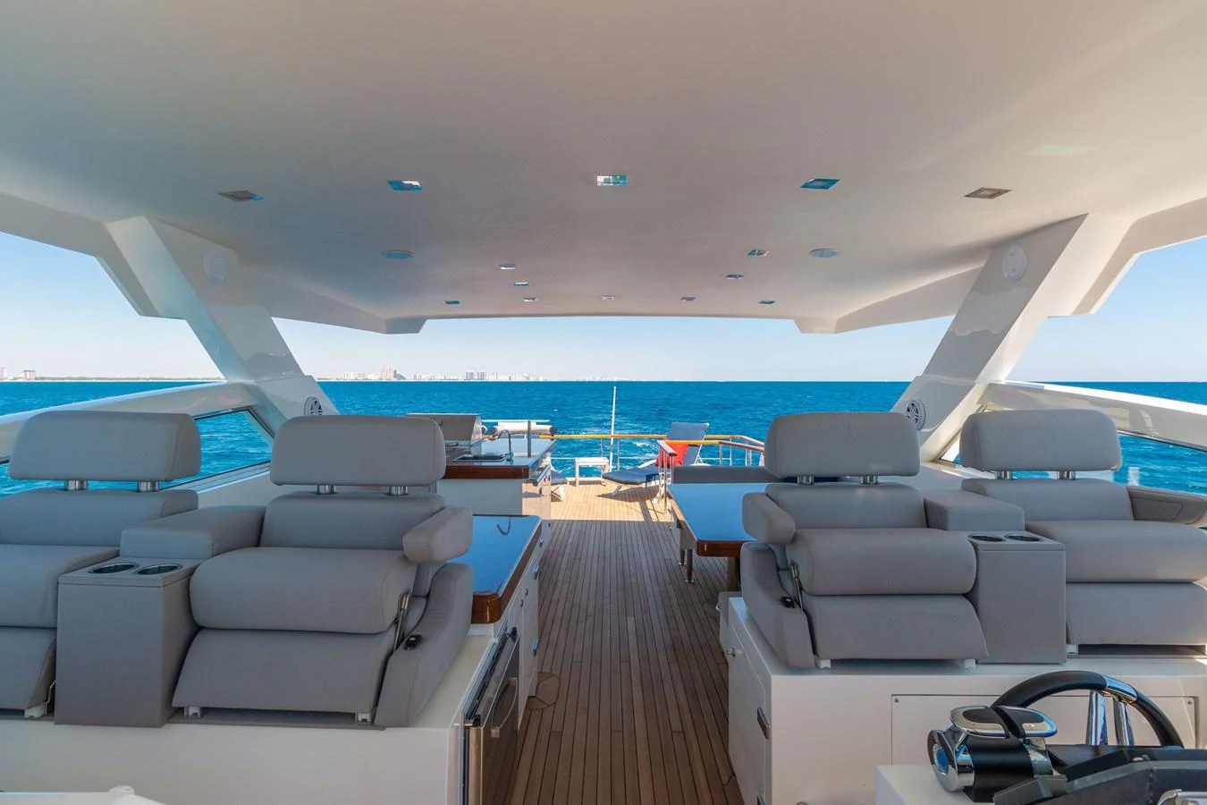 The flybridge offers a spacious and luxurious area for relaxation with stunning ocean views. aboard WHISTLE Yacht for Sale