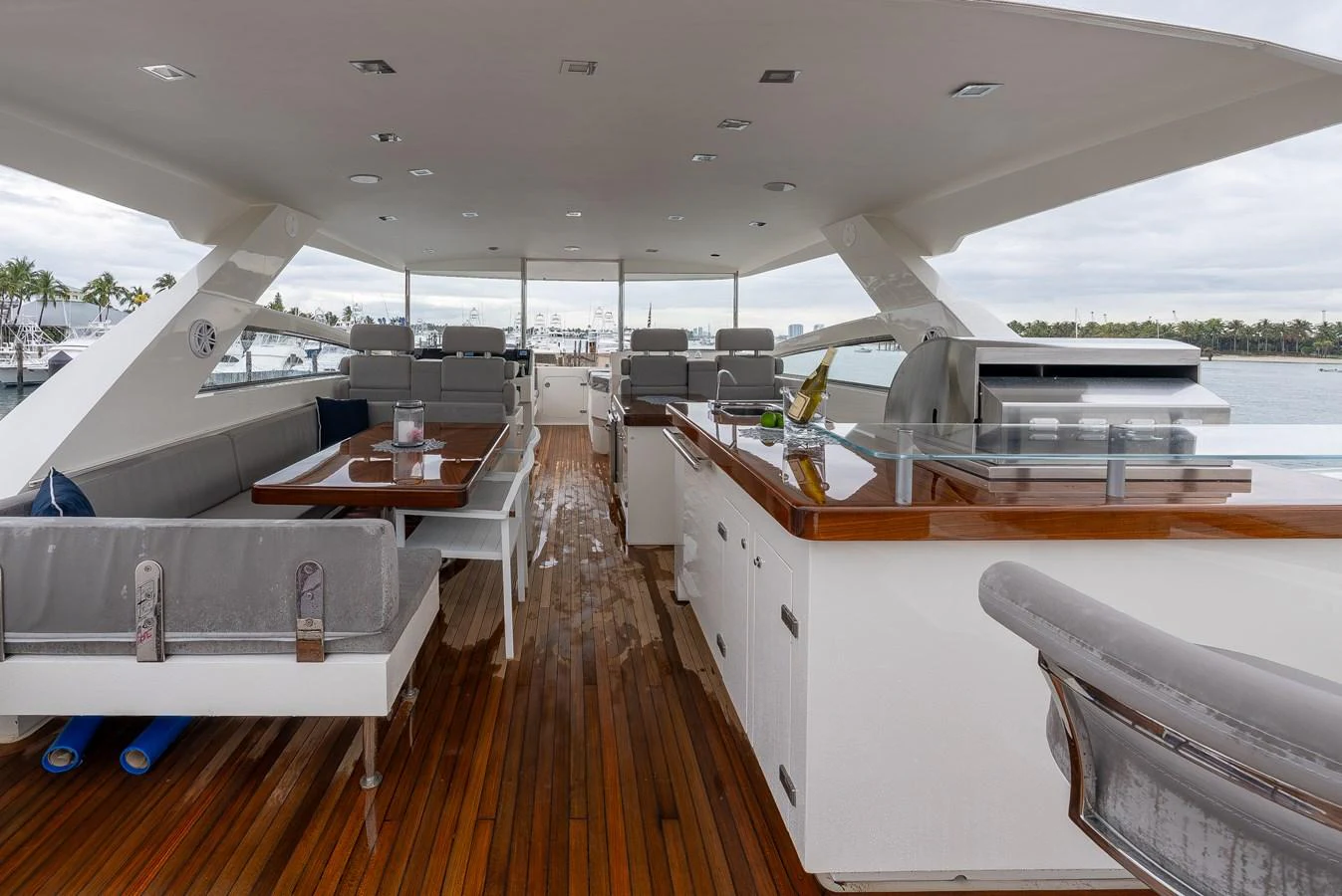 The flybridge offers a spacious and elegant area for dining and relaxation with a view. aboard WHISTLE Yacht for Sale