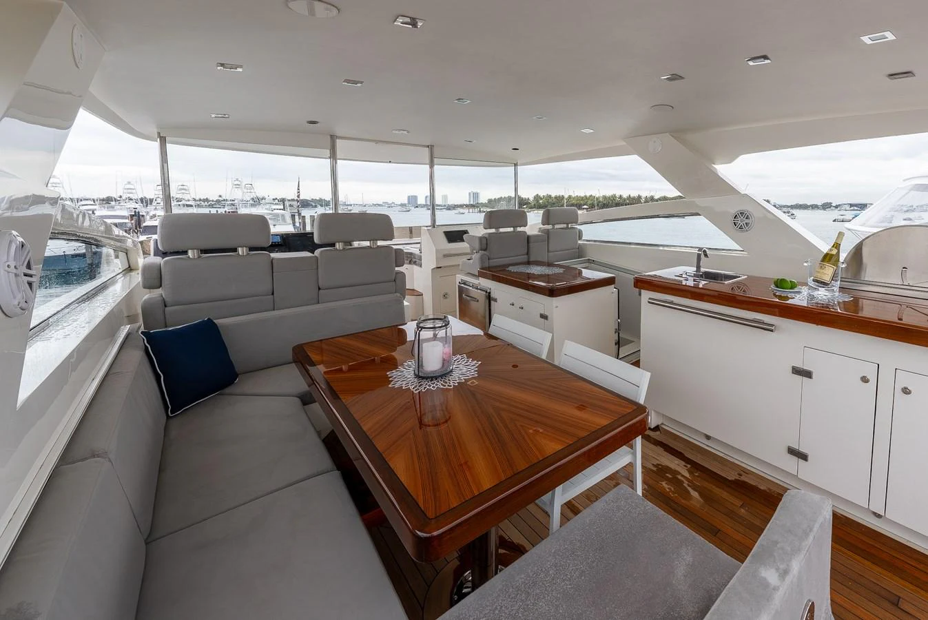 The salon features elegant wooden tables, plush seating, and ample natural light. aboard WHISTLE Yacht for Sale