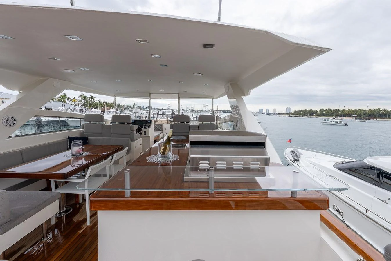 The flybridge offers a spacious and elegant area for relaxation and entertainment with a stunning view of the water. aboard WHISTLE Yacht for Sale