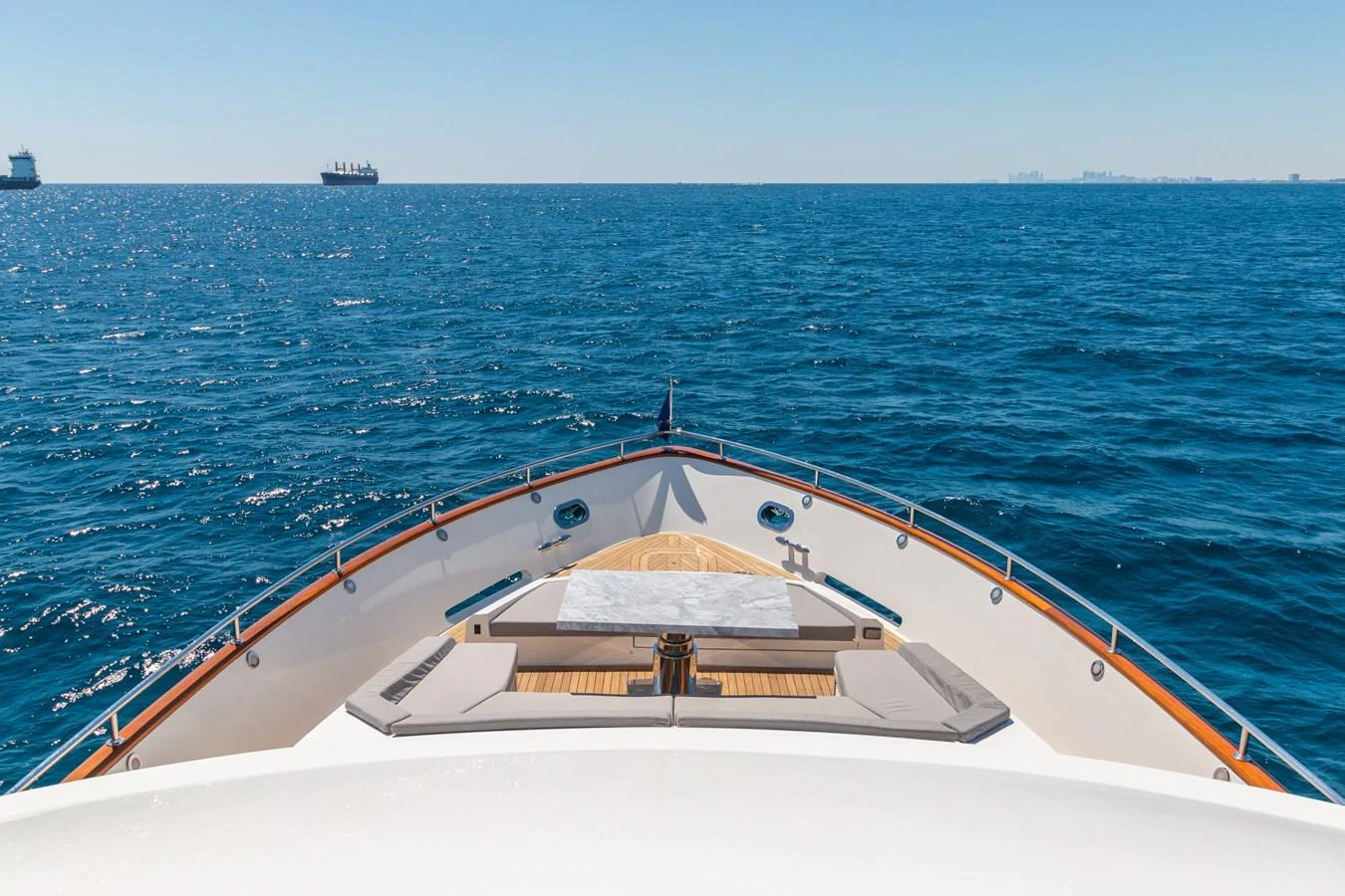 The yacht's bow offers a serene view of the open sea, perfect for relaxation. aboard WHISTLE Yacht for Sale