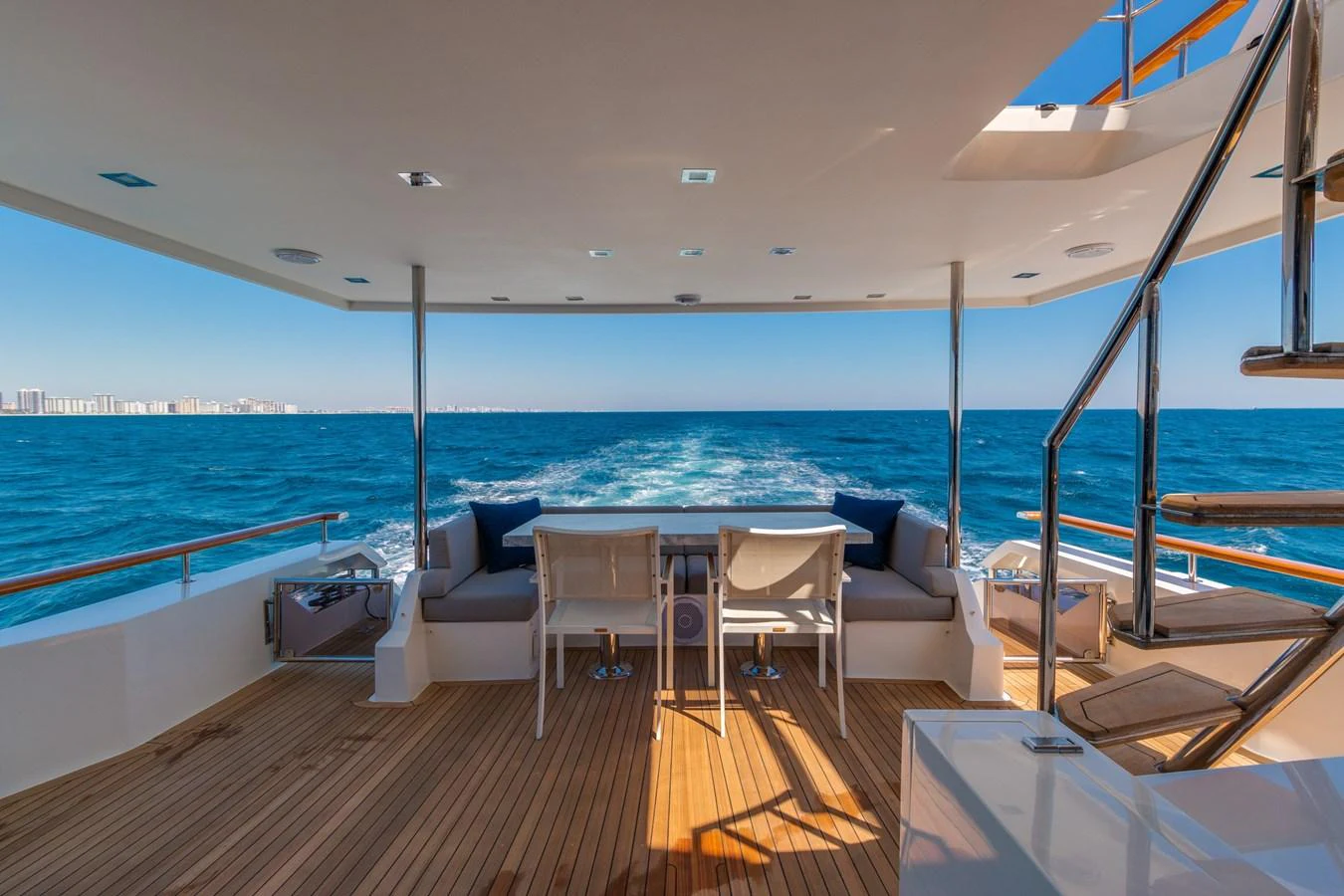 The aft deck offers a spacious and inviting area for relaxation and dining with stunning ocean views. aboard WHISTLE Yacht for Sale