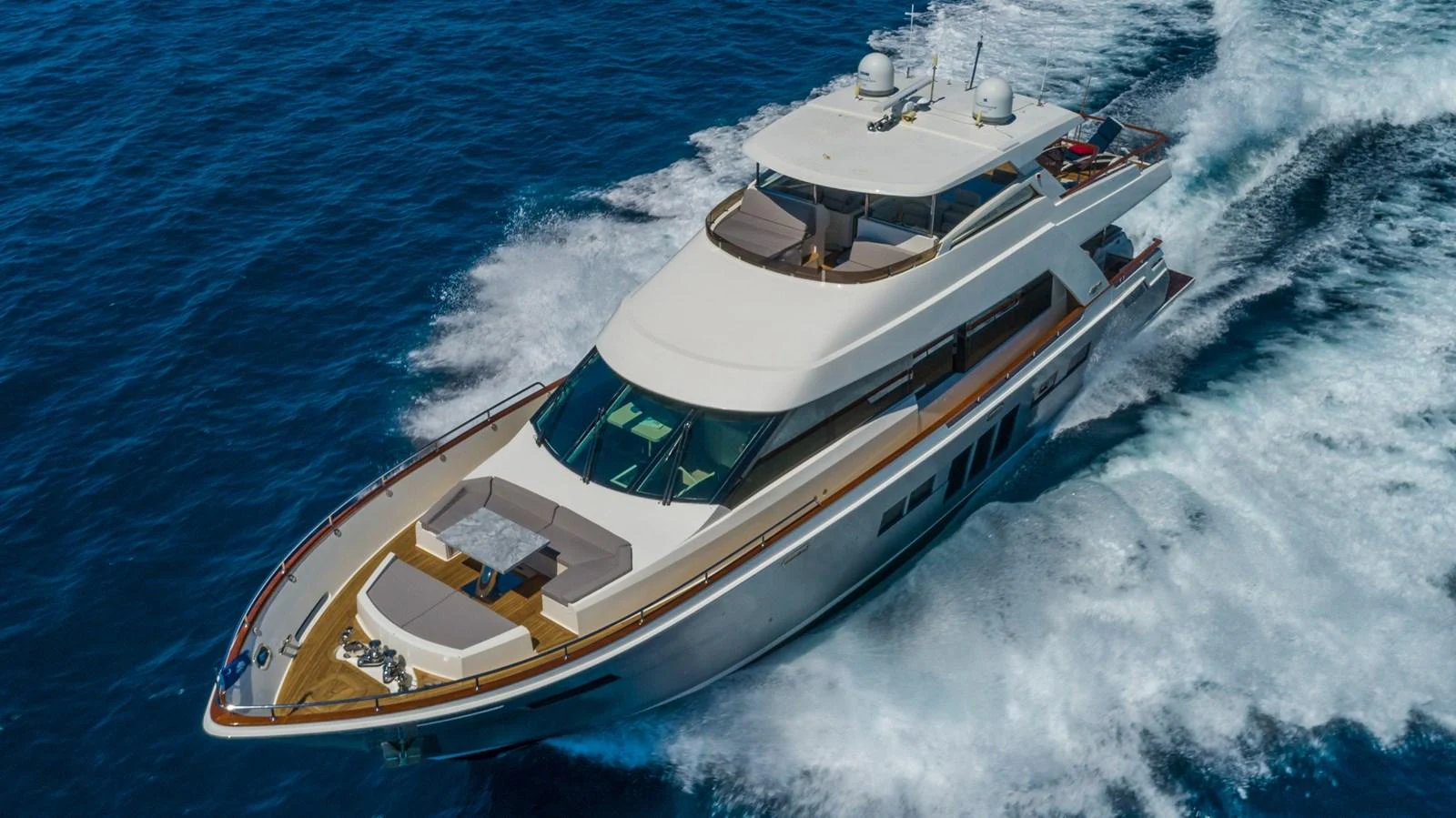 A sleek and modern yacht cruises swiftly through the open sea, showcasing its elegant design and luxurious amenities. aboard WHISTLE Yacht for Sale