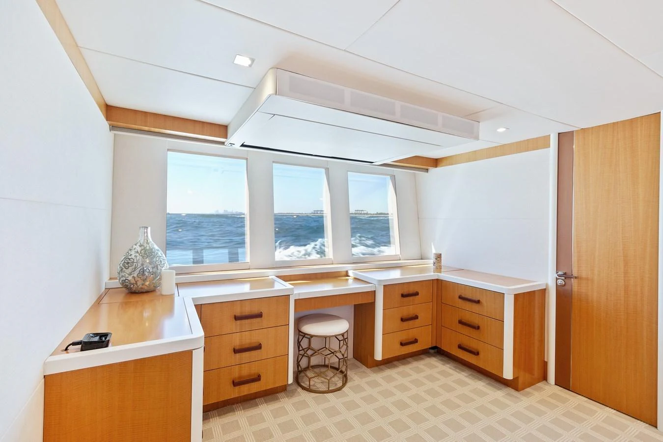 The yacht's office space features ample natural light and a serene ocean view. aboard WHISTLE Yacht for Sale