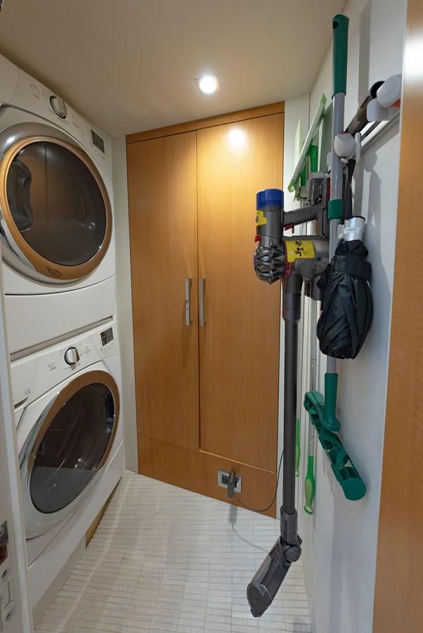 The yacht's laundry room is equipped with modern appliances and ample storage space. aboard WHISTLE Yacht for Sale