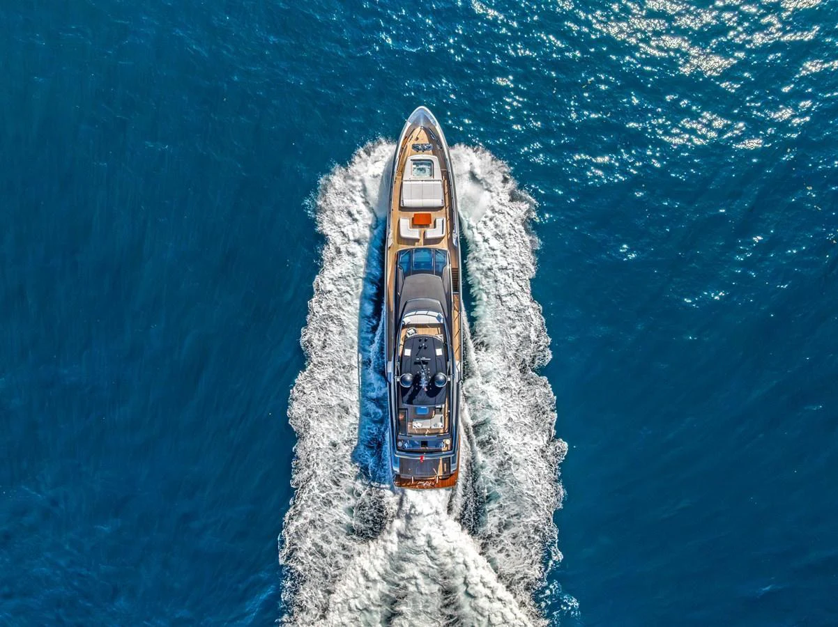 An elegant yacht cruises through the open water, leaving a trail of white foam in its wake. aboard EURO Yacht for Sale