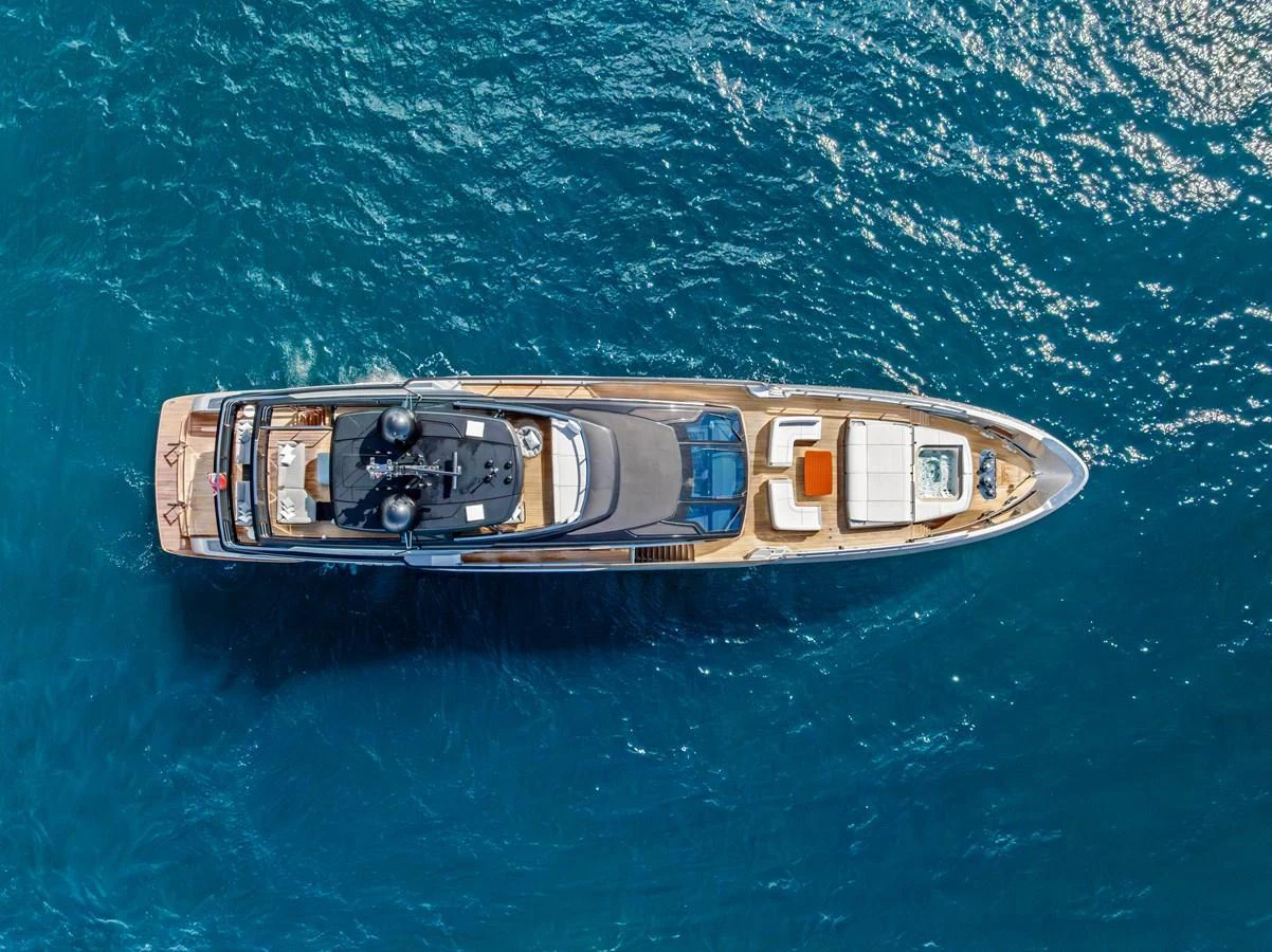 An aerial view of a sleek, modern yacht cruising through clear blue waters. aboard EURO Yacht for Sale