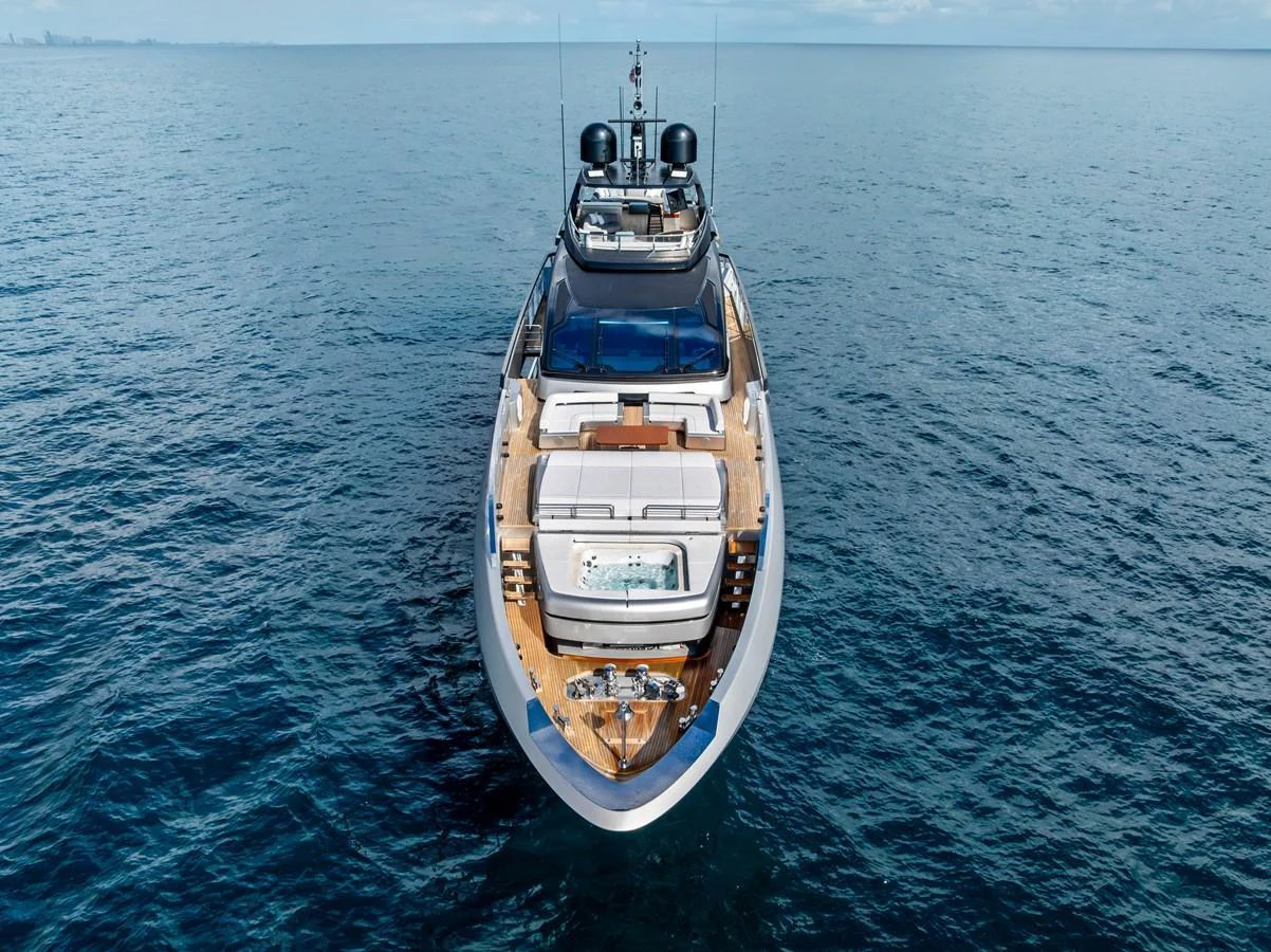 A sleek yacht glides gracefully on calm blue waters, showcasing its luxurious design and spacious deck. aboard EURO Yacht for Sale