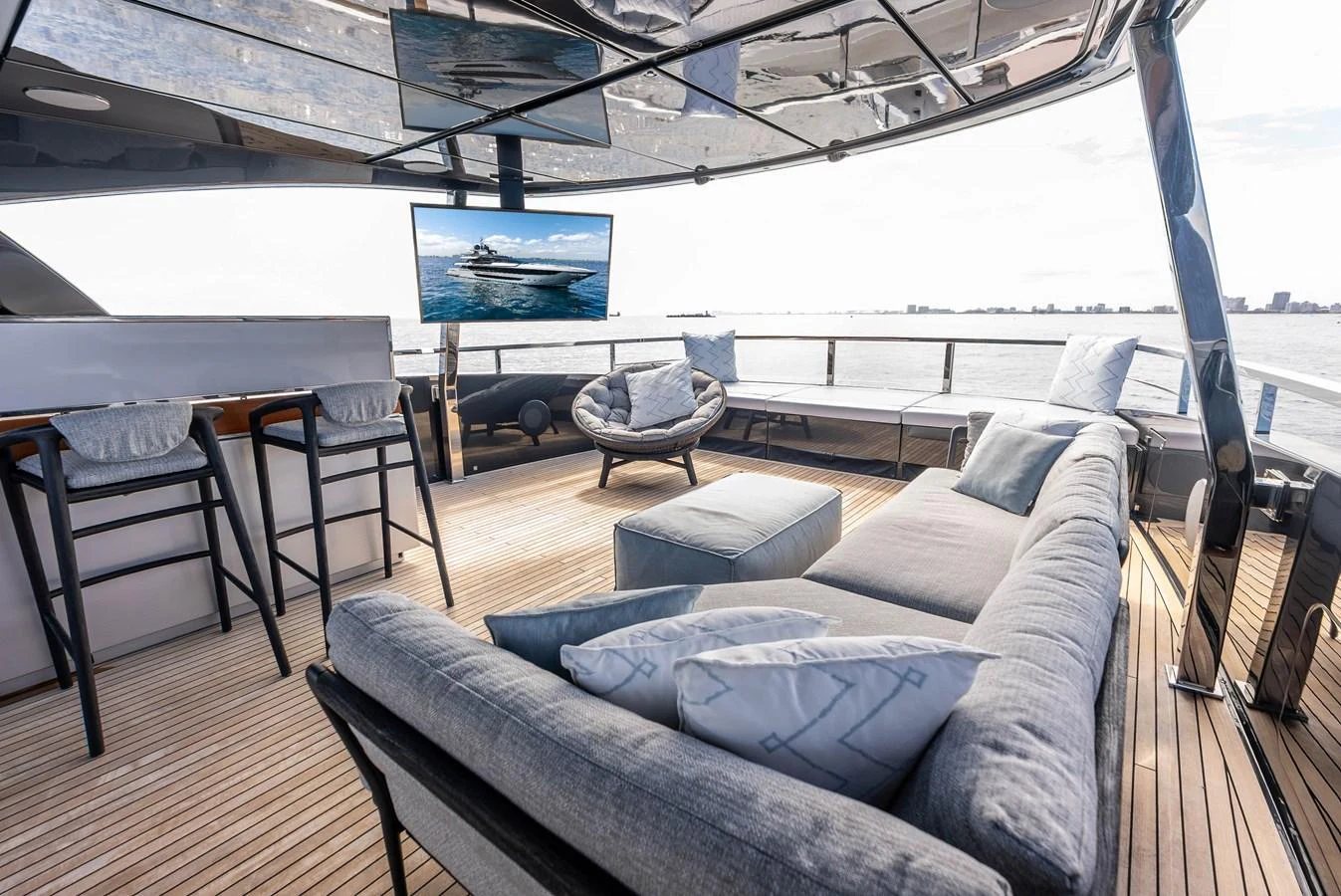 The flybridge features a luxurious seating area with a stunning view of the water. aboard EURO Yacht for Sale