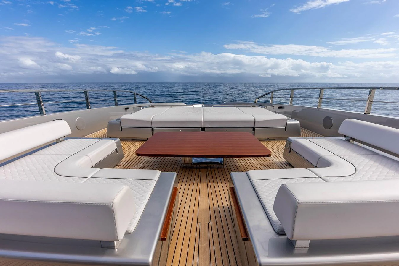 The sundeck offers a luxurious lounging area with plush seating and a central table, perfect for relaxation and socializing. aboard EURO Yacht for Sale