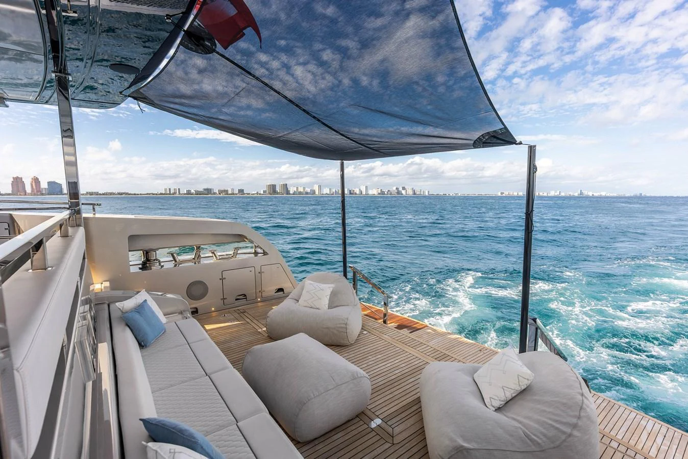 The aft deck offers a luxurious lounging area with plush seating and stunning ocean views. aboard EURO Yacht for Sale
