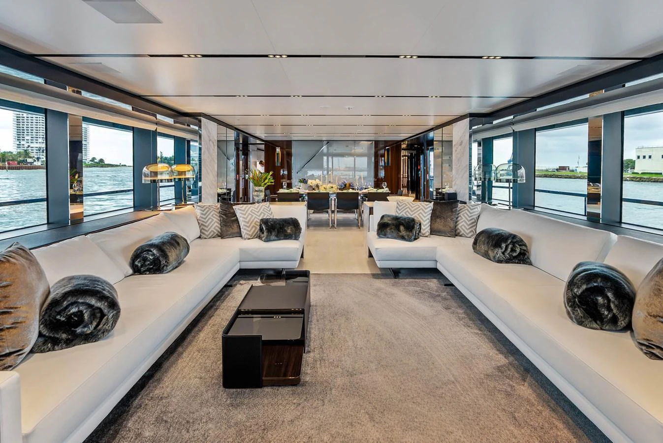 The spacious salon features elegant seating with panoramic views of the water. aboard EURO Yacht for Sale