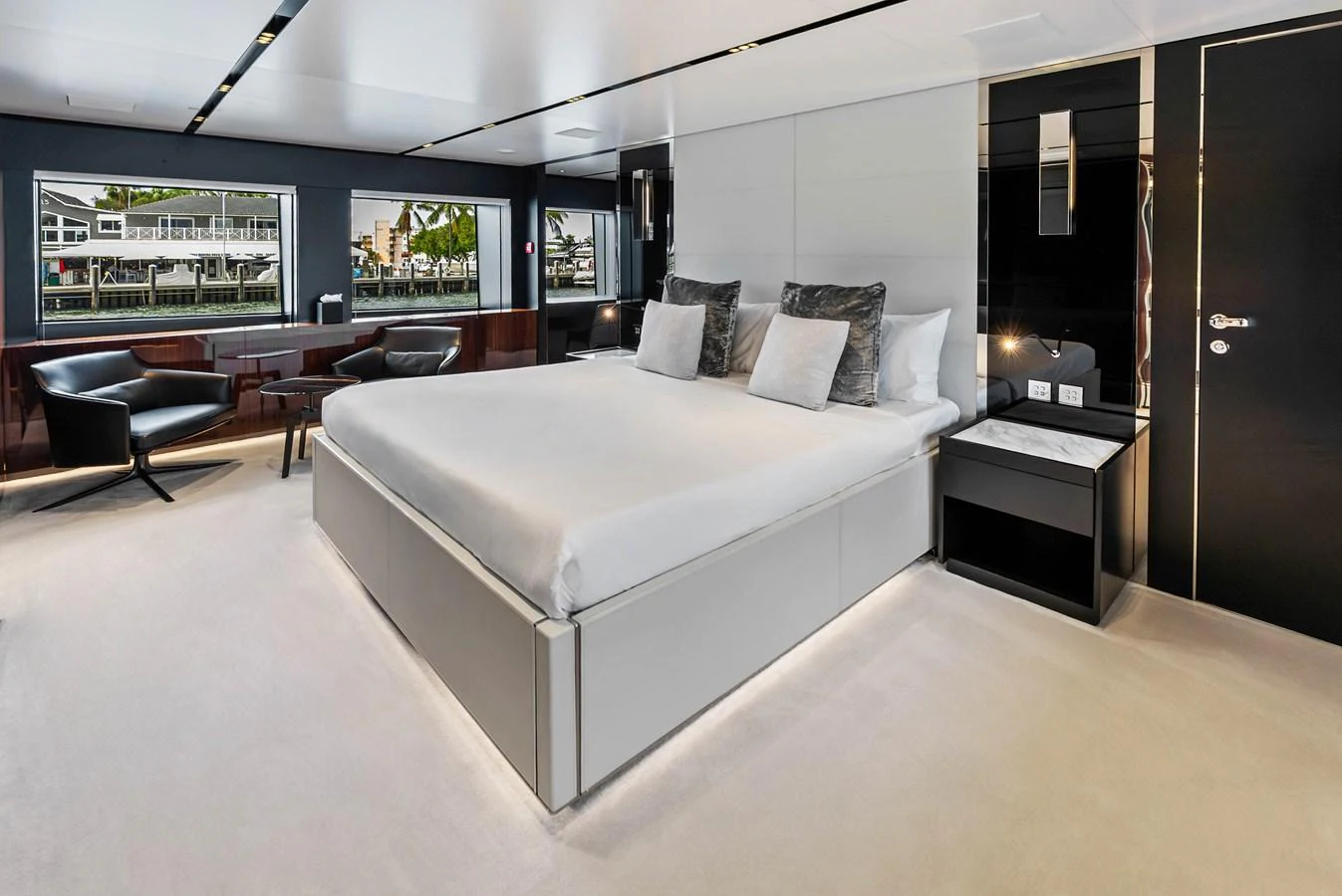 The master stateroom features a spacious bed, modern furnishings, and large windows for natural light. aboard EURO Yacht for Sale
