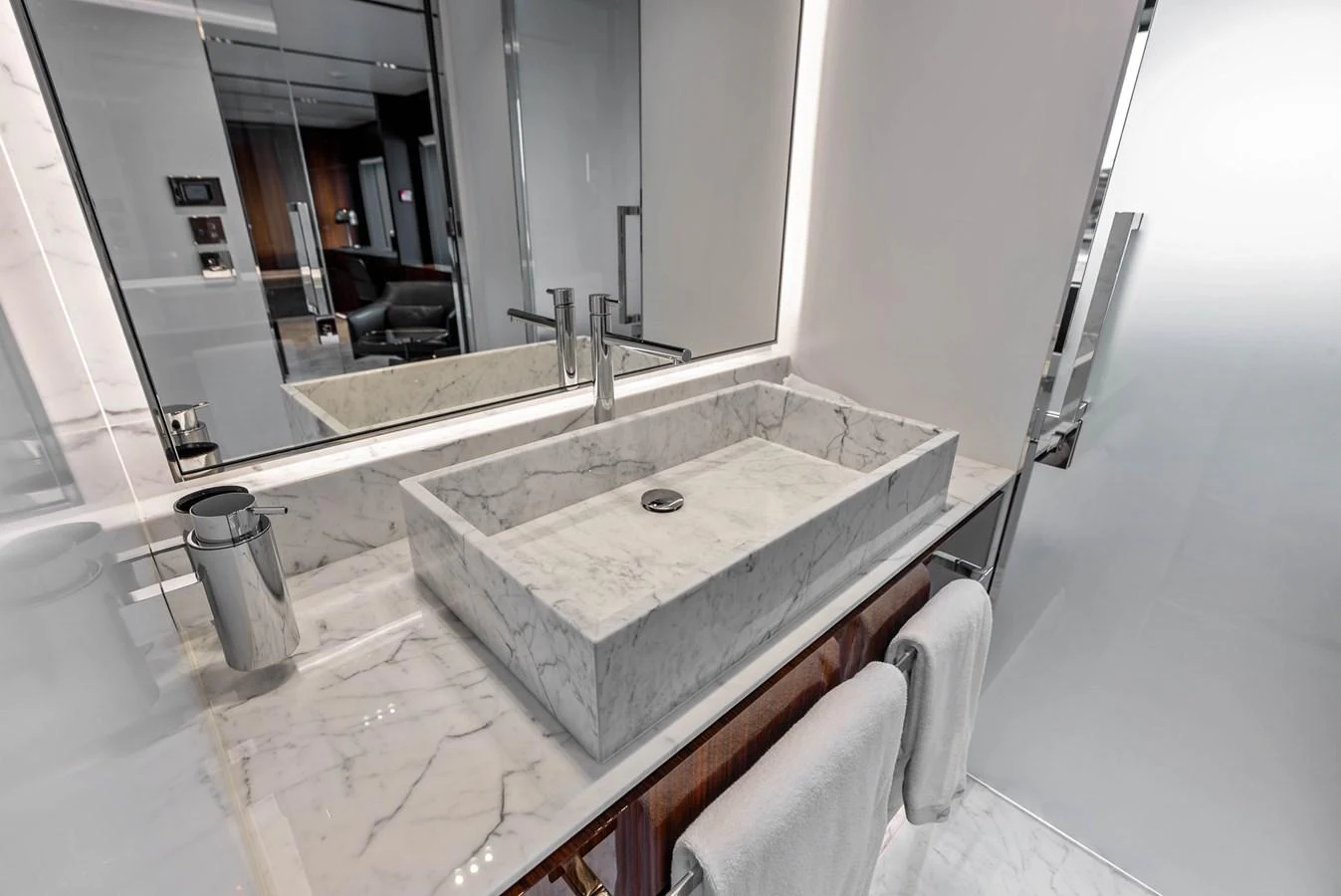 The bathroom features a luxurious marble sink and modern fixtures. aboard EURO Yacht for Sale