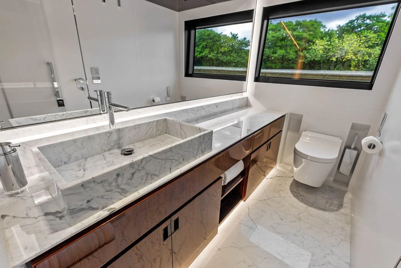 The yacht's bathroom features a sleek design with marble countertops and modern fixtures. aboard EURO Yacht for Sale