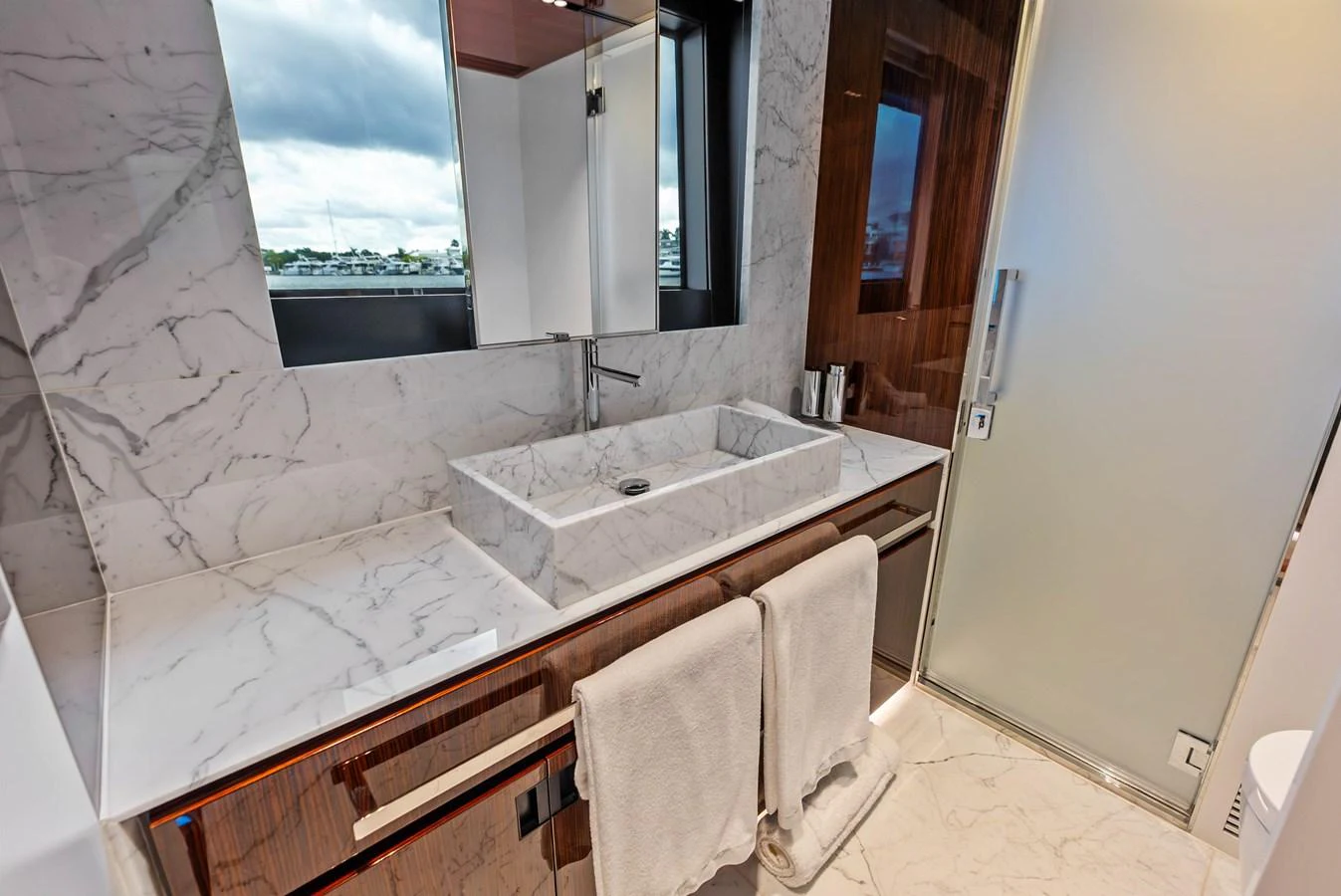 The yacht's bathroom features a sleek, modern design with marble surfaces and elegant fixtures. aboard EURO Yacht for Sale