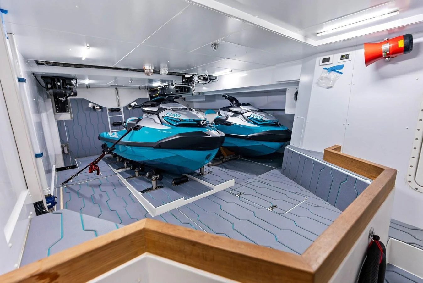 The yacht features a well-organized storage area for jet skis, ensuring easy access and secure stowage. aboard EURO Yacht for Sale