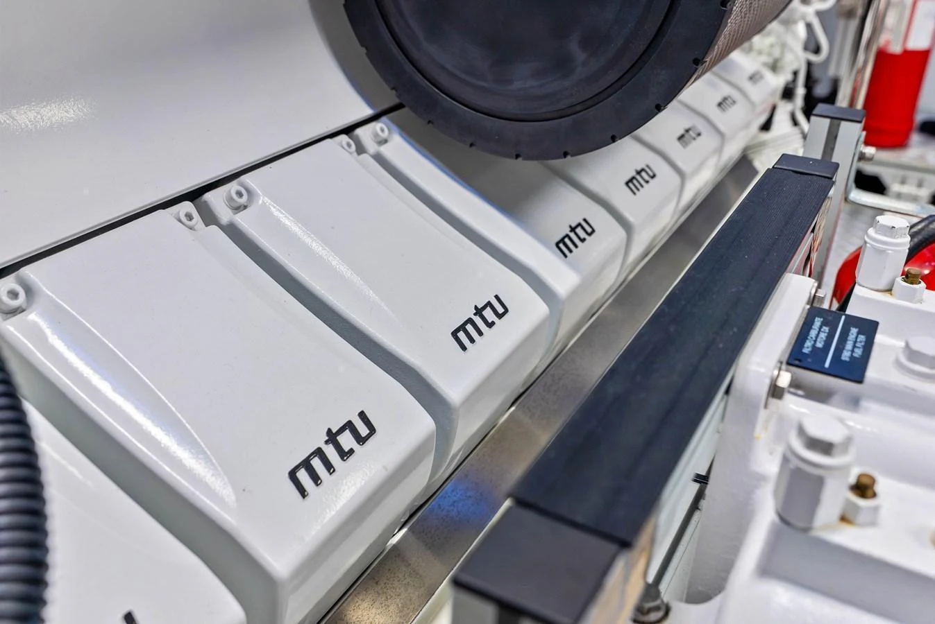 The image showcases the pristine engine components of the yacht, highlighting the MTU branding. aboard EURO Yacht for Sale