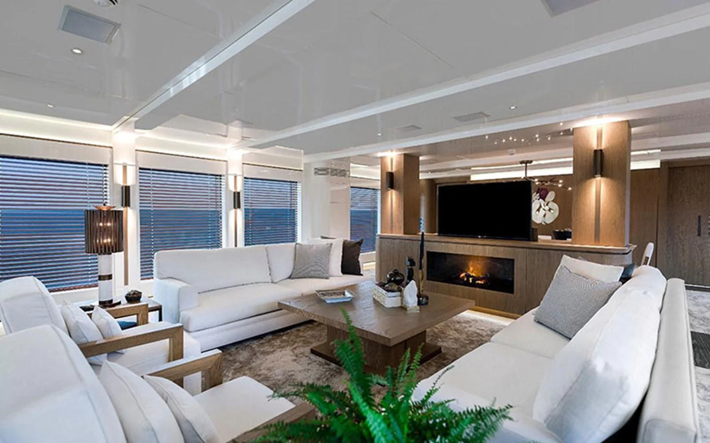 The salon offers a spacious and luxurious seating area with modern decor and ample natural light. aboard CMB  108 Yacht for Sale