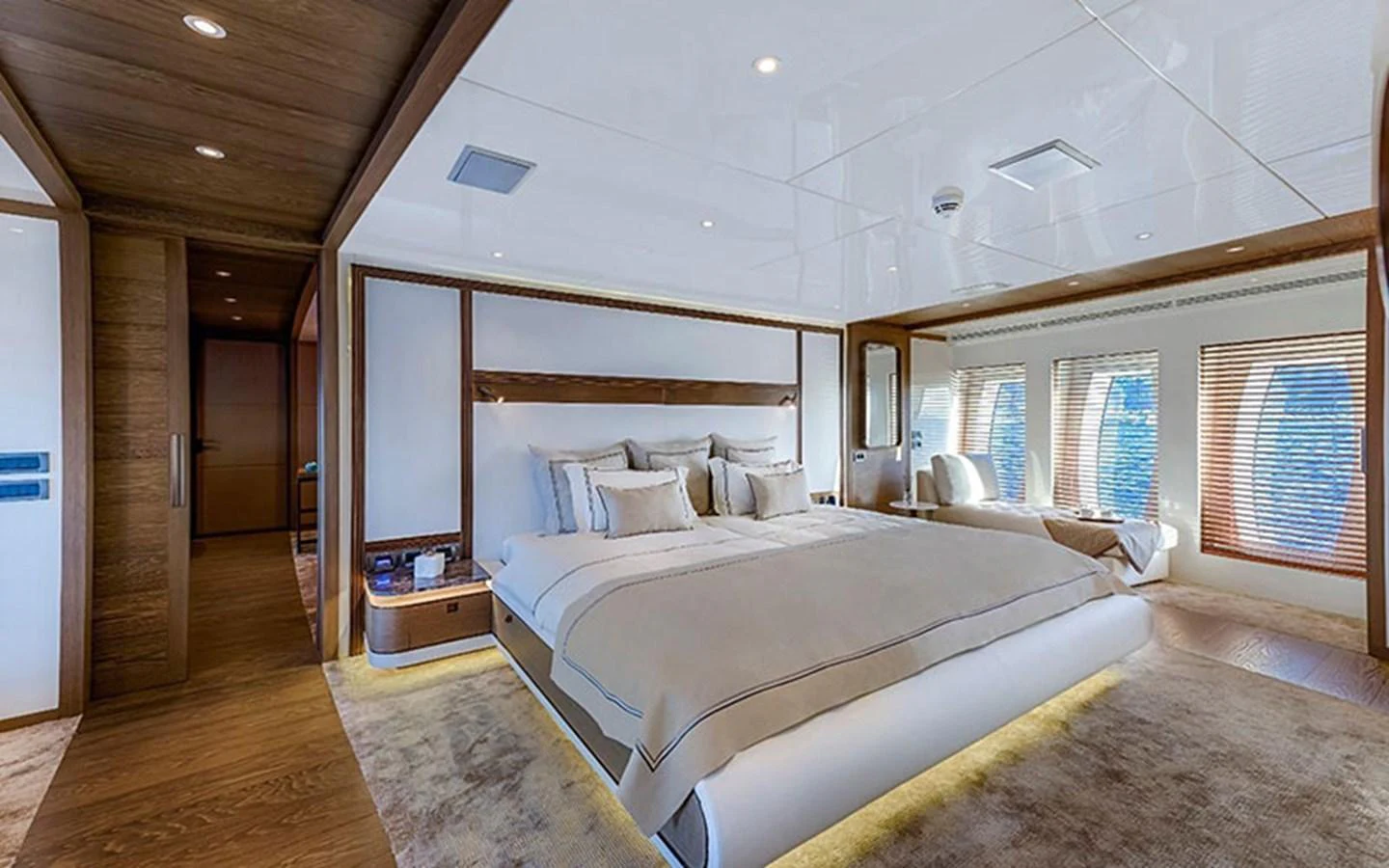 The master stateroom features a spacious bed, elegant decor, and large windows for natural light. aboard CMB  108 Yacht for Sale
