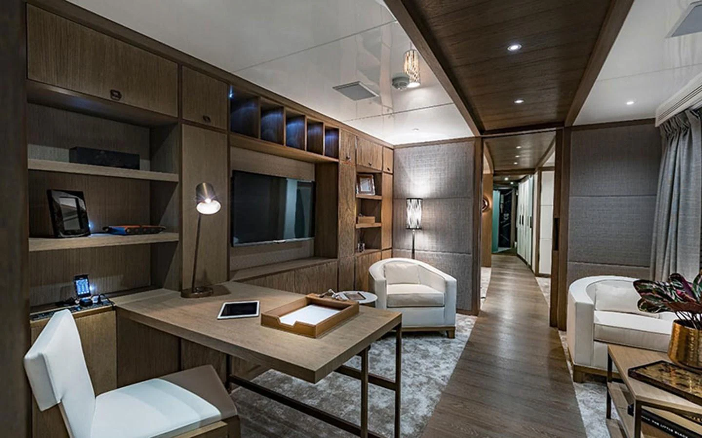 The yacht's office features modern furnishings and a serene ambiance, perfect for productivity at sea. aboard CMB  108 Yacht for Sale