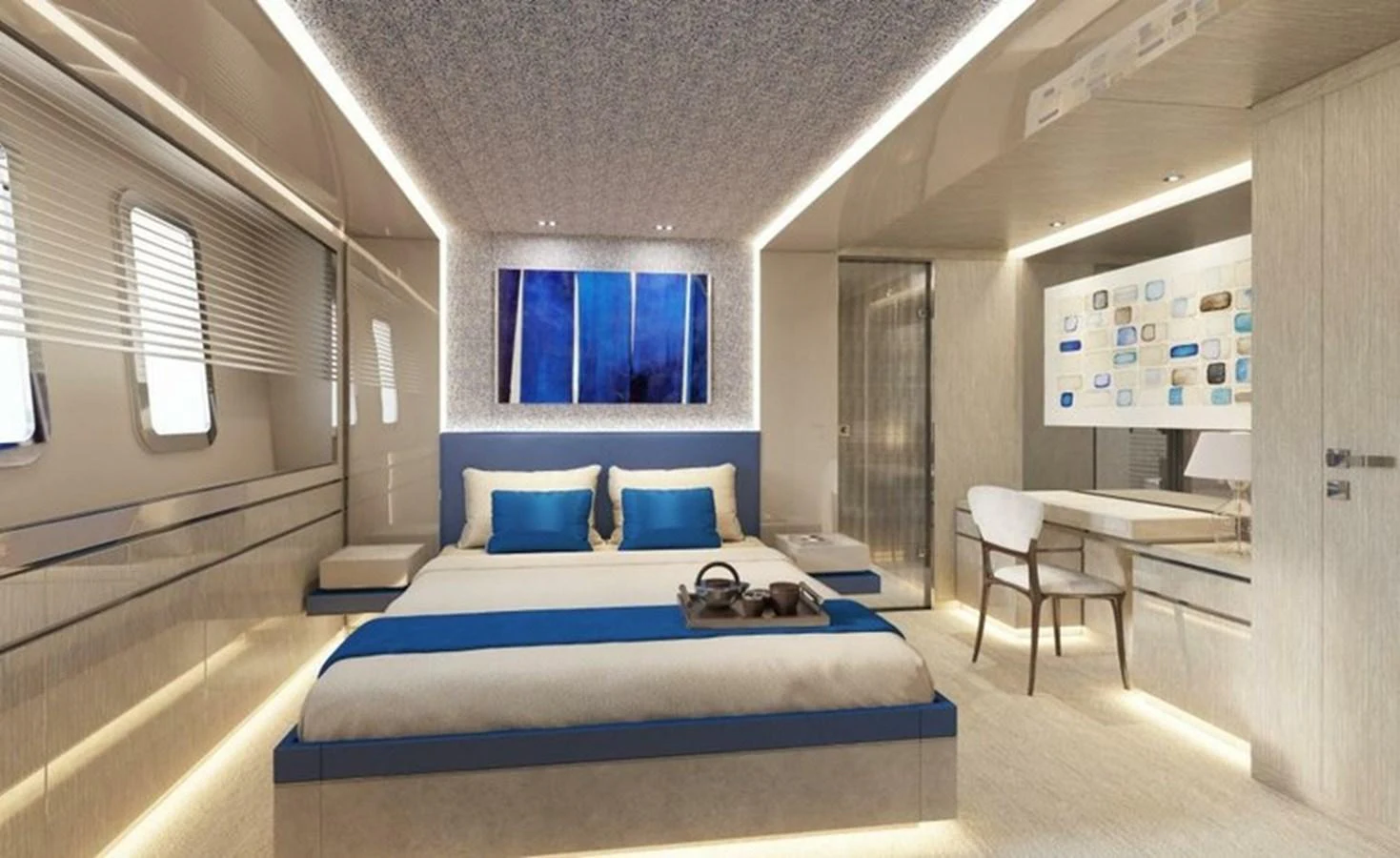 A luxurious stateroom featuring a large bed with blue accents and modern decor. aboard OCEAN DREAMWALKER III Yacht for Sale