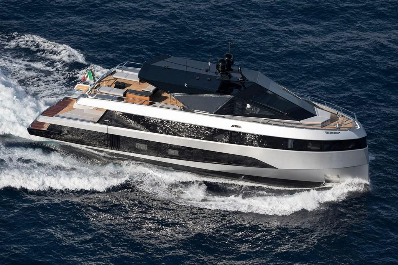 A sleek and modern yacht glides effortlessly through the water, showcasing its elegant design and luxurious amenities. aboard CARAT Yacht for Sale