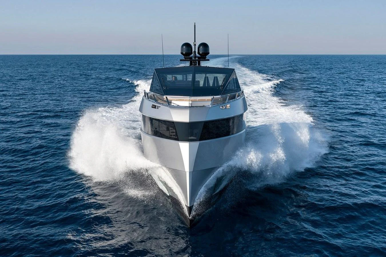 A sleek and modern yacht cuts through the open sea, showcasing its powerful design and performance. aboard CARAT Yacht for Sale