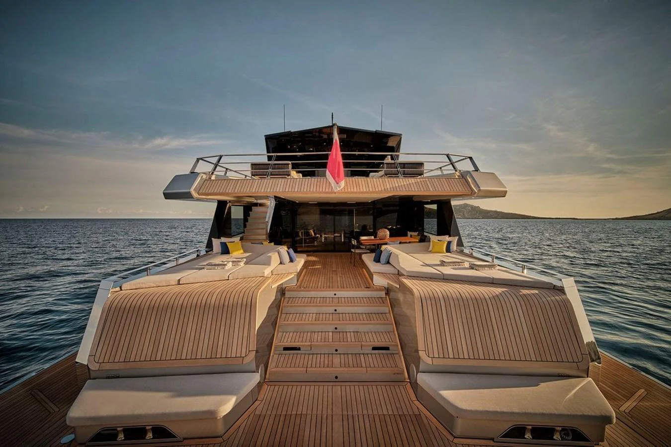The yacht's aft deck features luxurious sun loungers and a spacious seating area, perfect for relaxation and socializing. aboard CARAT Yacht for Sale