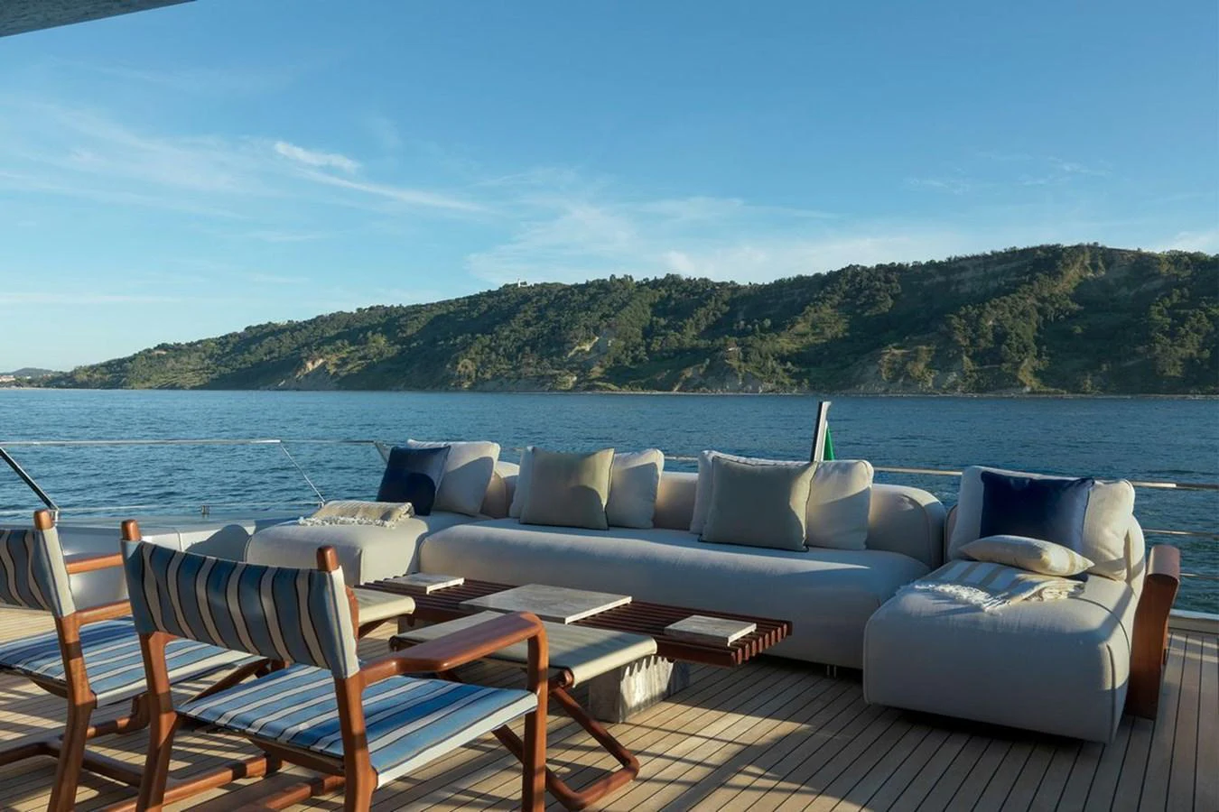 The aft deck features a luxurious seating area with stunning views of the surrounding water and landscape. aboard CARAT Yacht for Sale