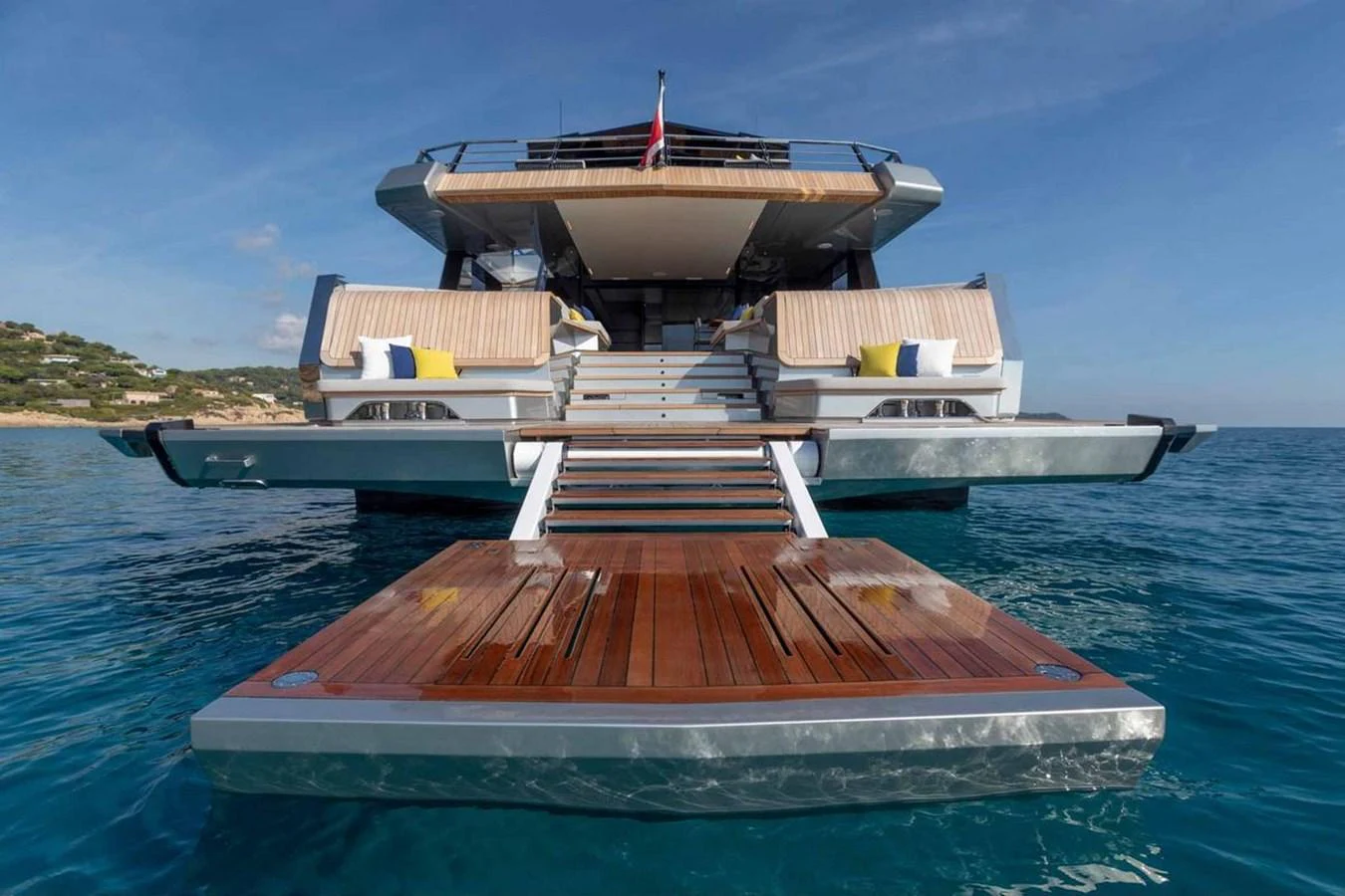 The yacht's aft deck features a spacious swim platform and inviting lounging areas, perfect for relaxation and water activities. aboard CARAT Yacht for Sale