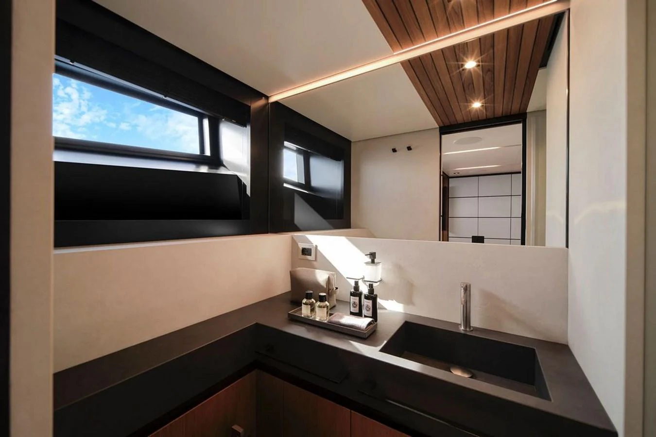 A sleek and modern yacht bathroom with stylish fixtures and ample natural light. aboard CARAT Yacht for Sale
