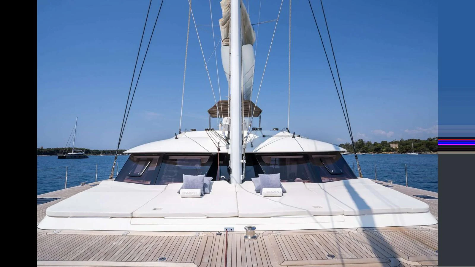 The yacht's spacious foredeck features ample lounging areas with plush cushions, perfect for relaxation under the sun. aboard SEAZEN II Yacht for Sale