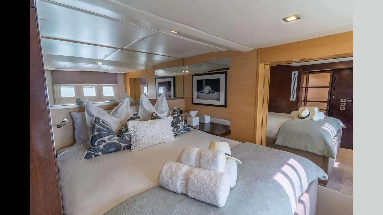 The stateroom features a luxurious bed with plush linens and elegant decor. aboard SEAZEN II Yacht for Sale