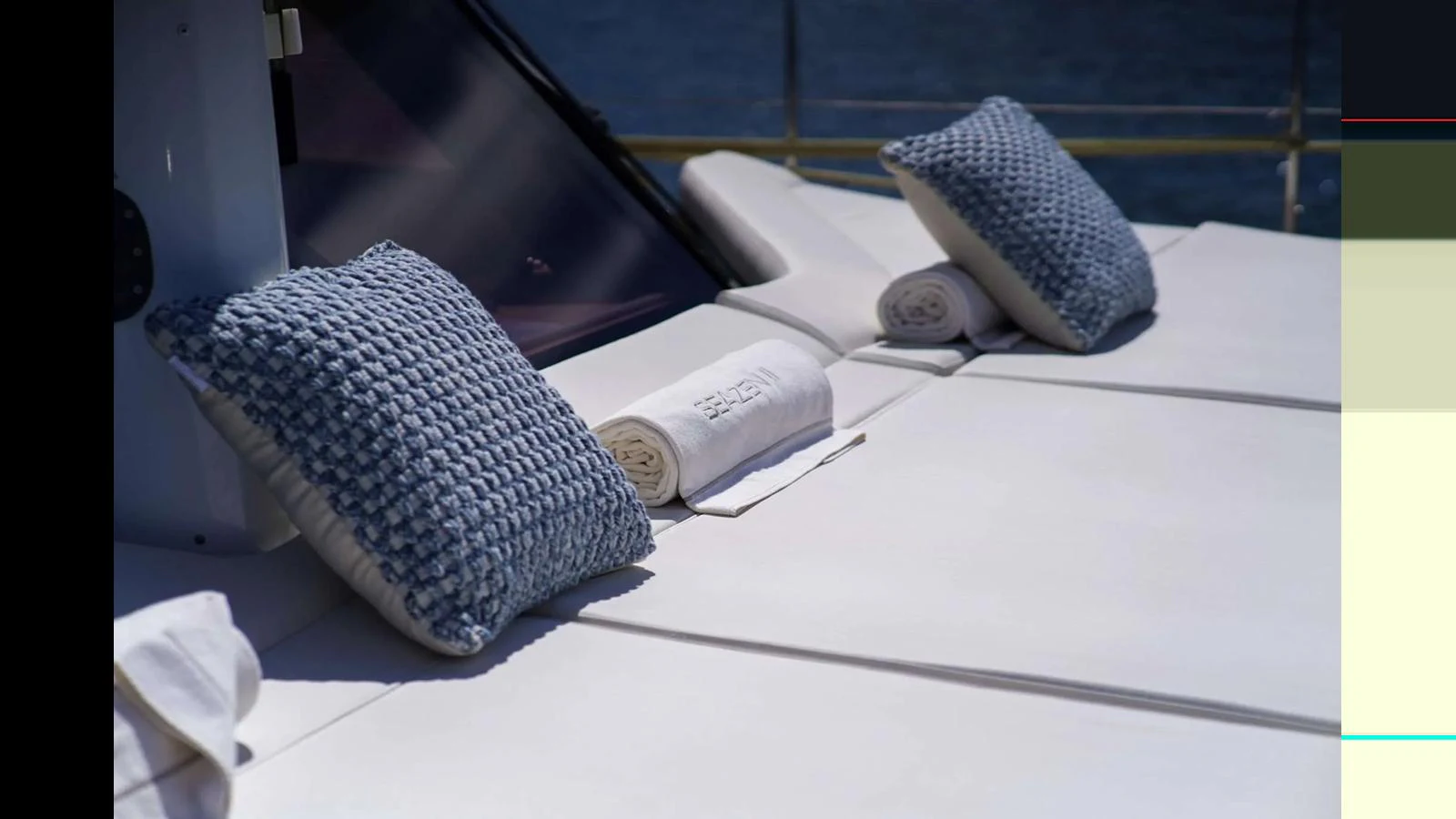 The sundeck features plush cushions and rolled towels, perfect for relaxation under the sun. aboard SEAZEN II Yacht for Sale