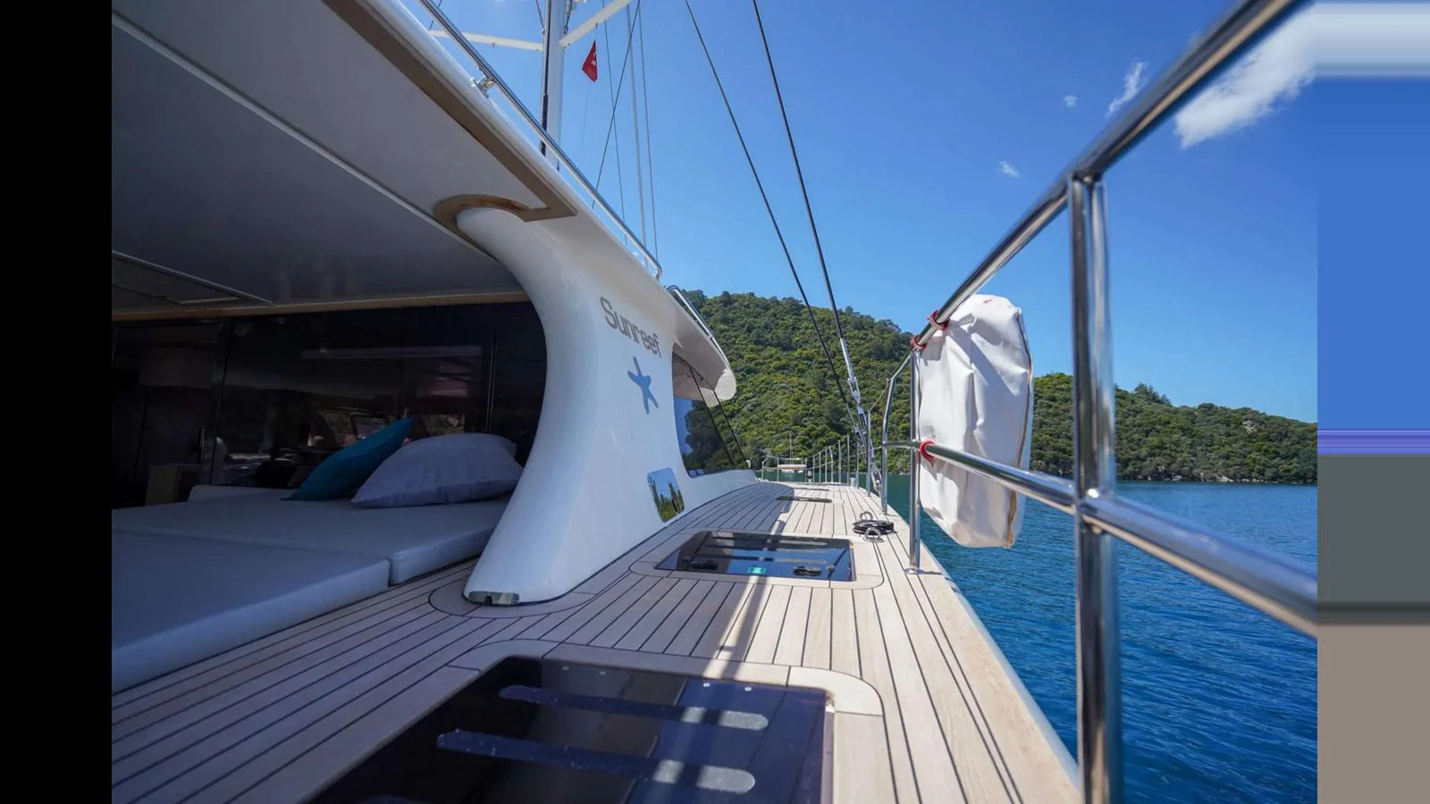 The yacht's deck offers a serene view of the surrounding waters and lush greenery. aboard SEAZEN II Yacht for Sale