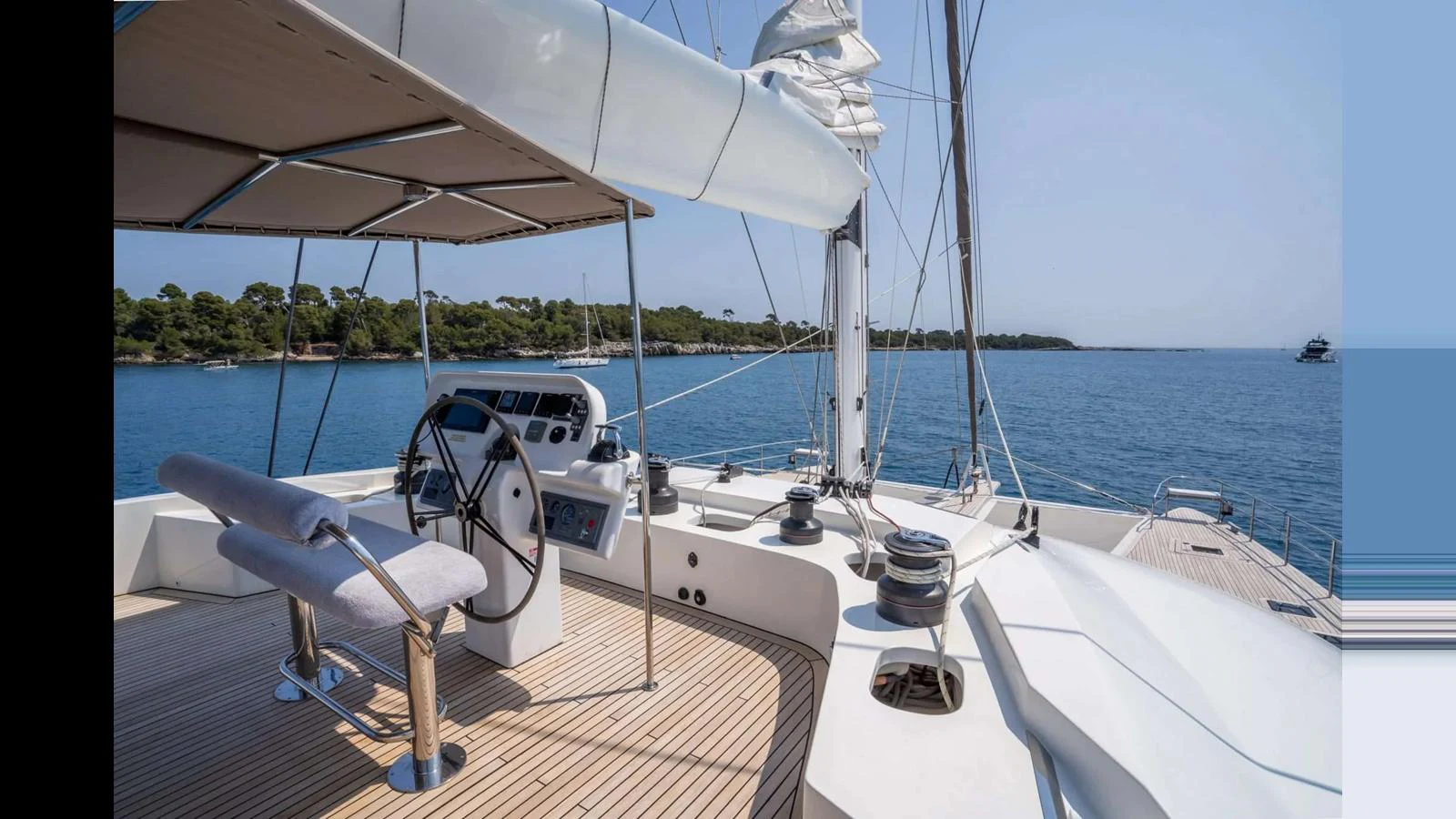 The yacht's helm station offers a commanding view of the serene waters and surrounding landscape. aboard SEAZEN II Yacht for Sale
