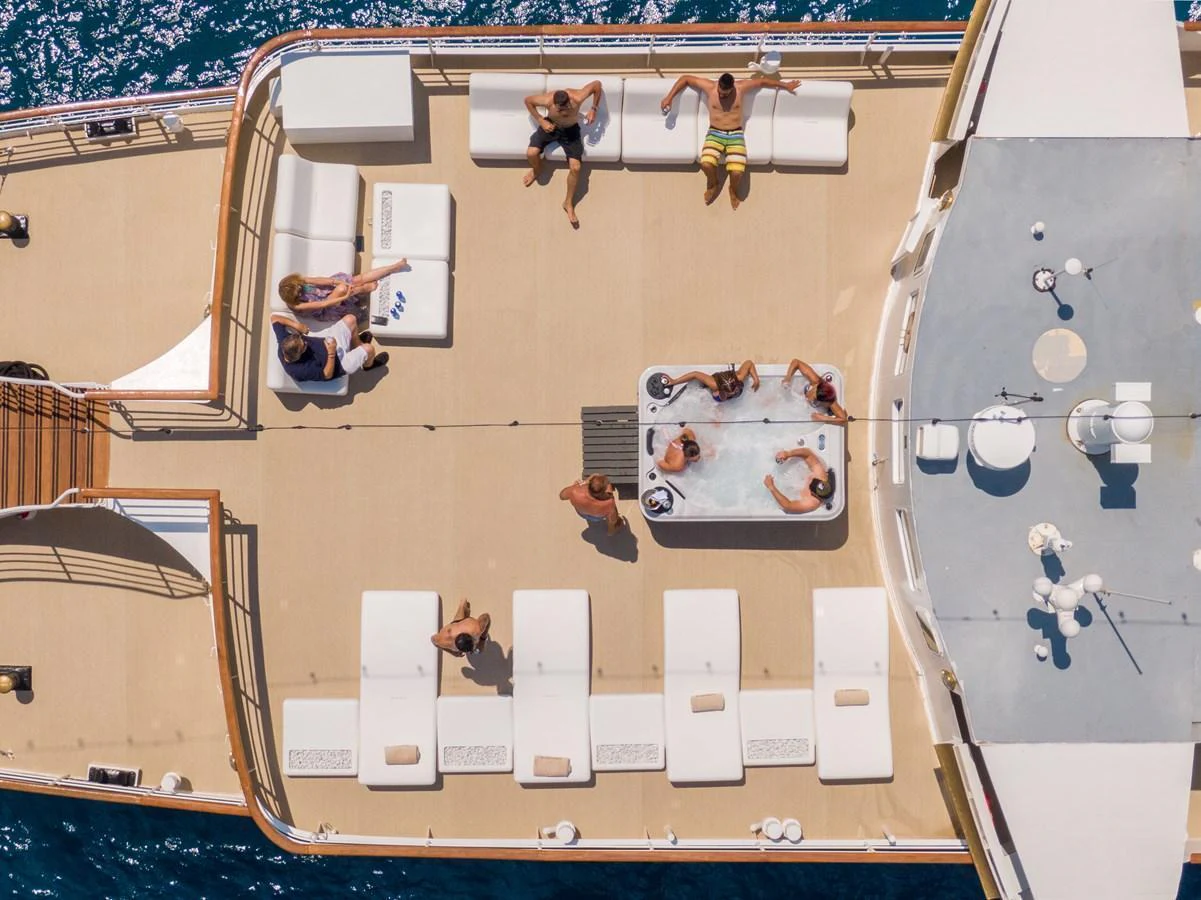 The sundeck features a spacious lounging area with a jacuzzi, perfect for relaxation and socializing. aboard HARMONY II Yacht for Sale