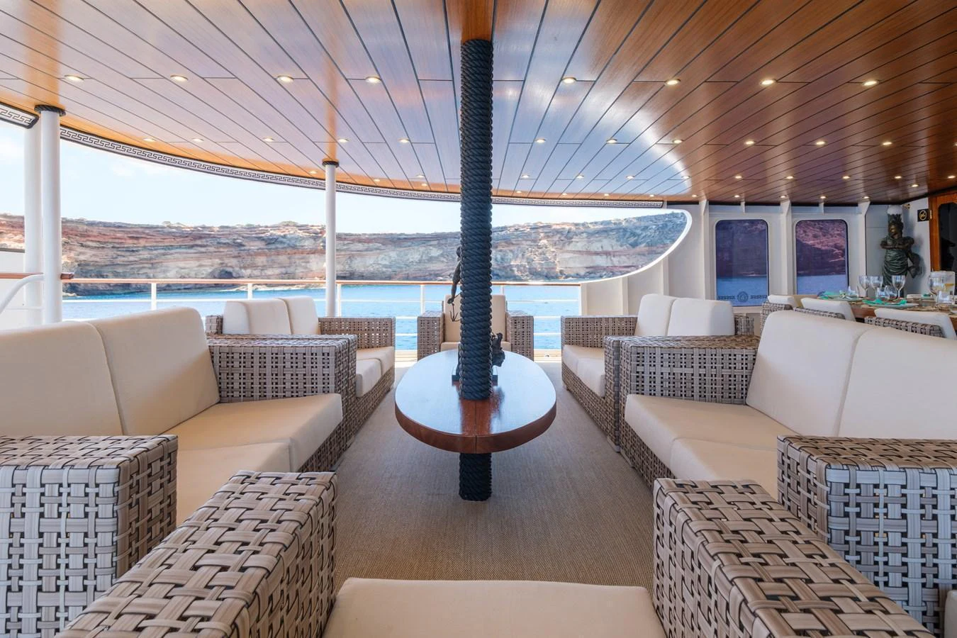 The aft deck features comfortable seating with a stunning view of the surrounding waters. aboard HARMONY II Yacht for Sale