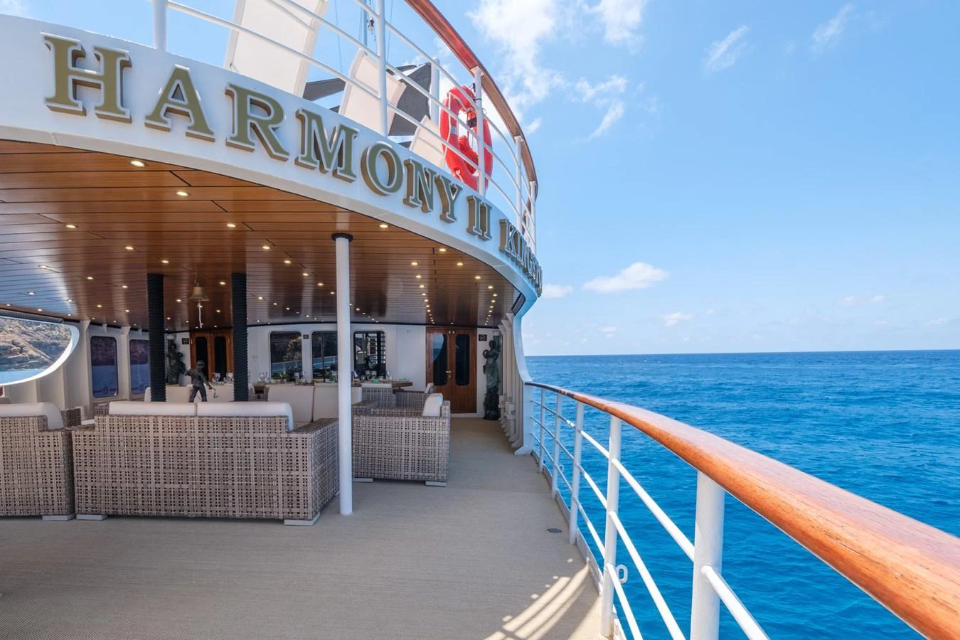 The aft deck offers a spacious and inviting area for relaxation with comfortable seating and stunning ocean views. aboard HARMONY II Yacht for Sale